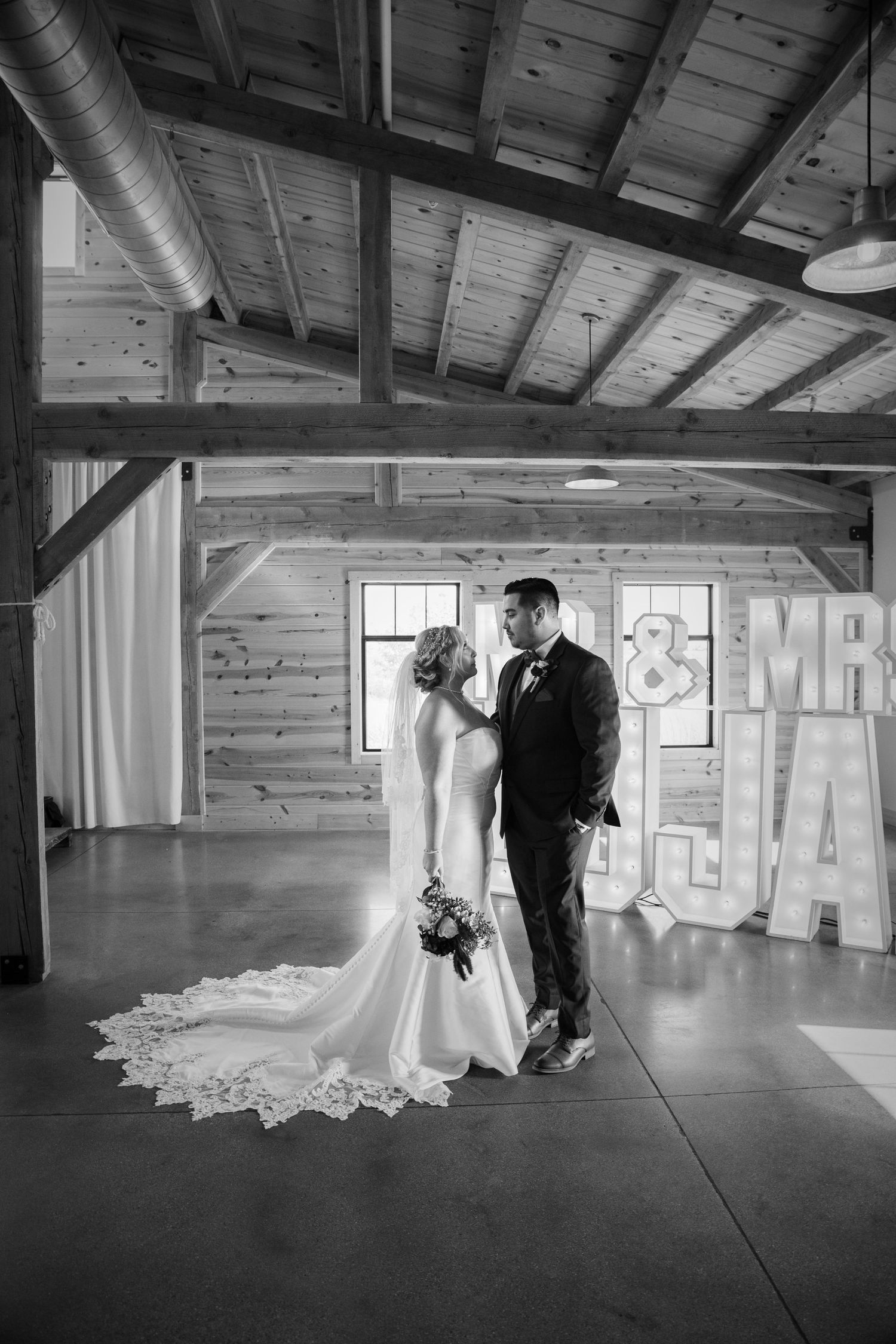 Black and white photos in a rustic wooden venue show dancing silhouettes.