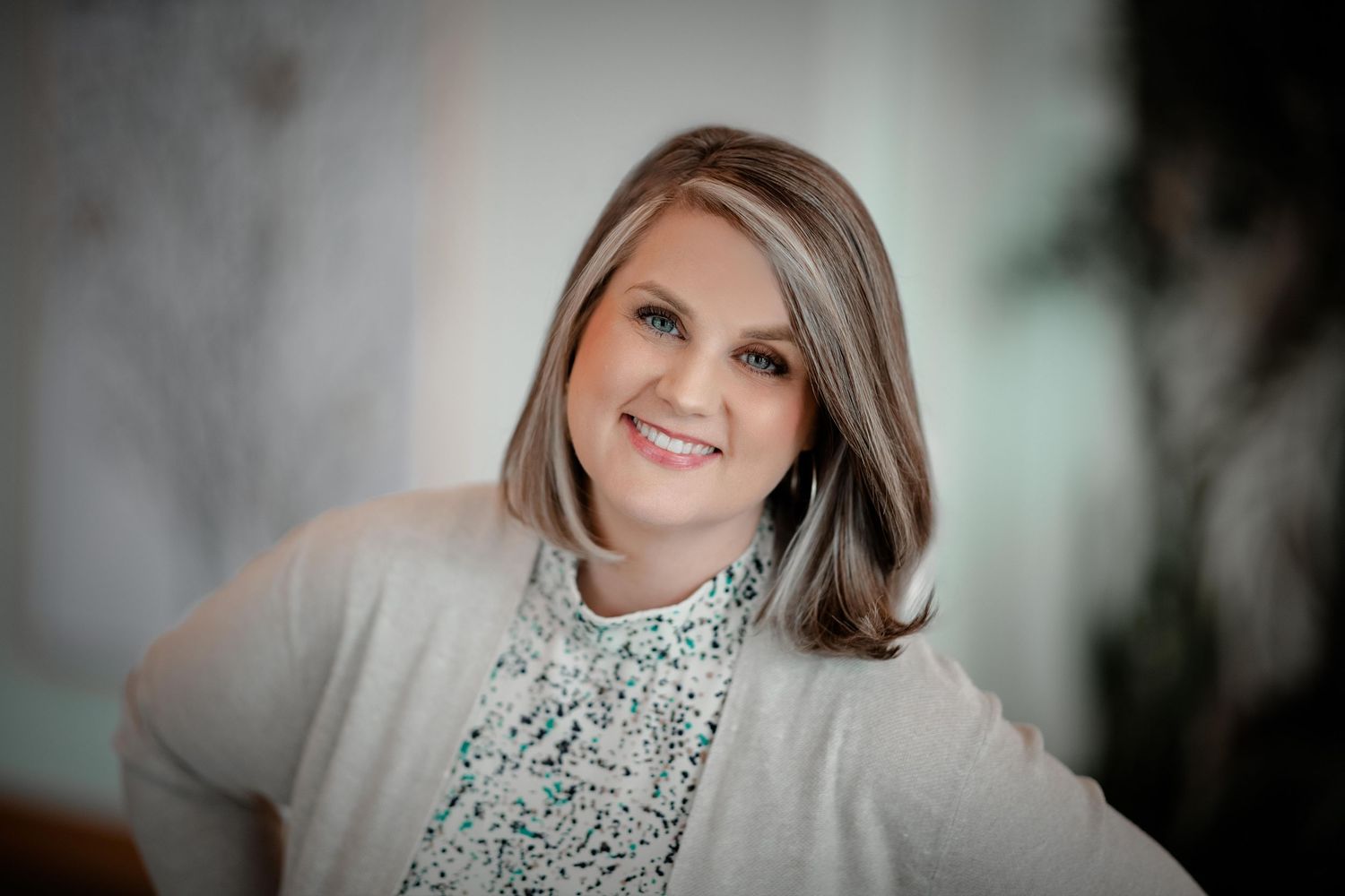 Professional headshot portraits in black and white with soft lighting and elegant styling.