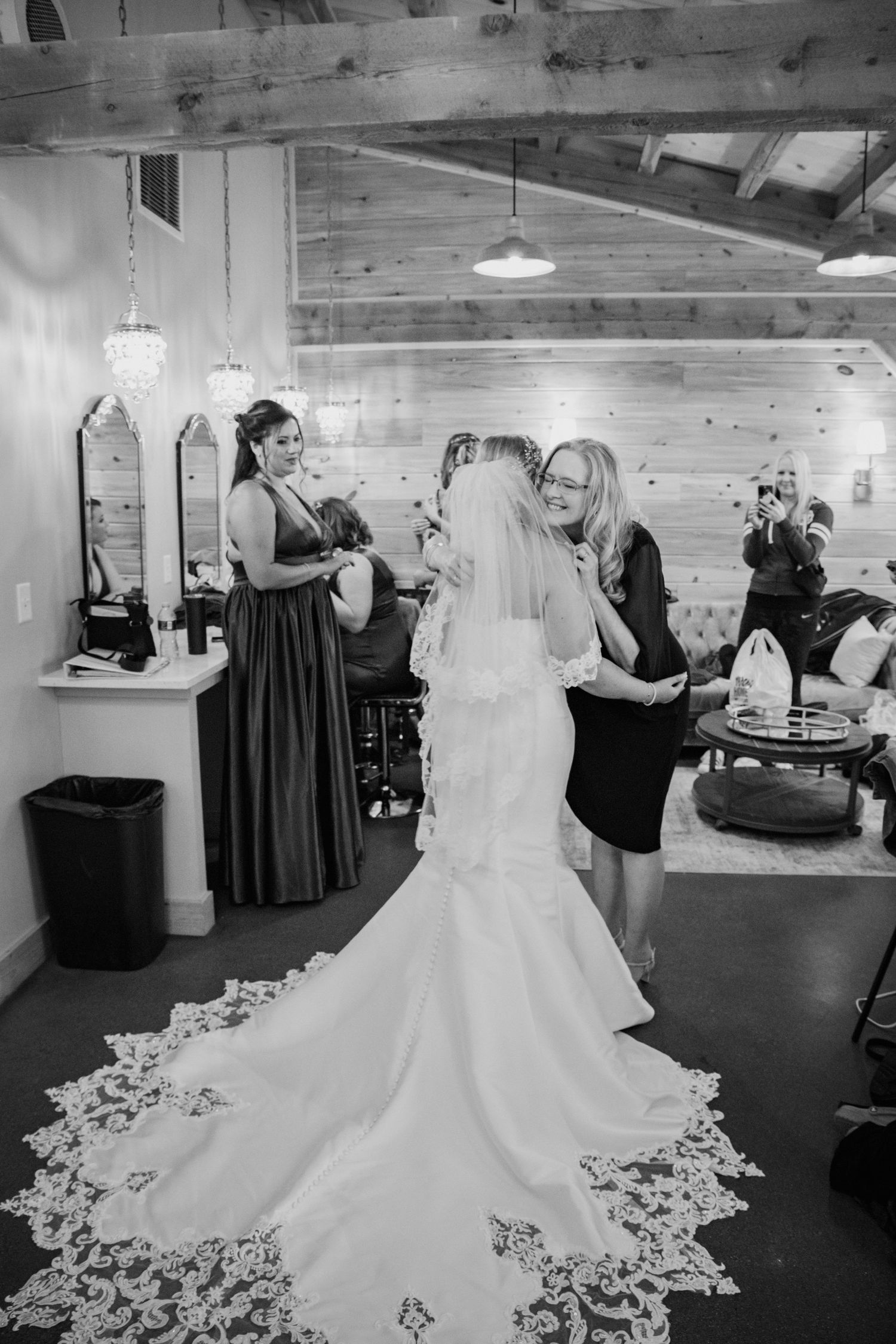 Wedding dress preparation and fitting sequence in a spacious bridal suite.