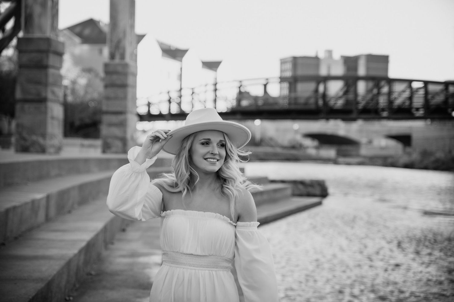 A series of black and white photos showing vintage wedding moments with elegant decor and romantic poses.