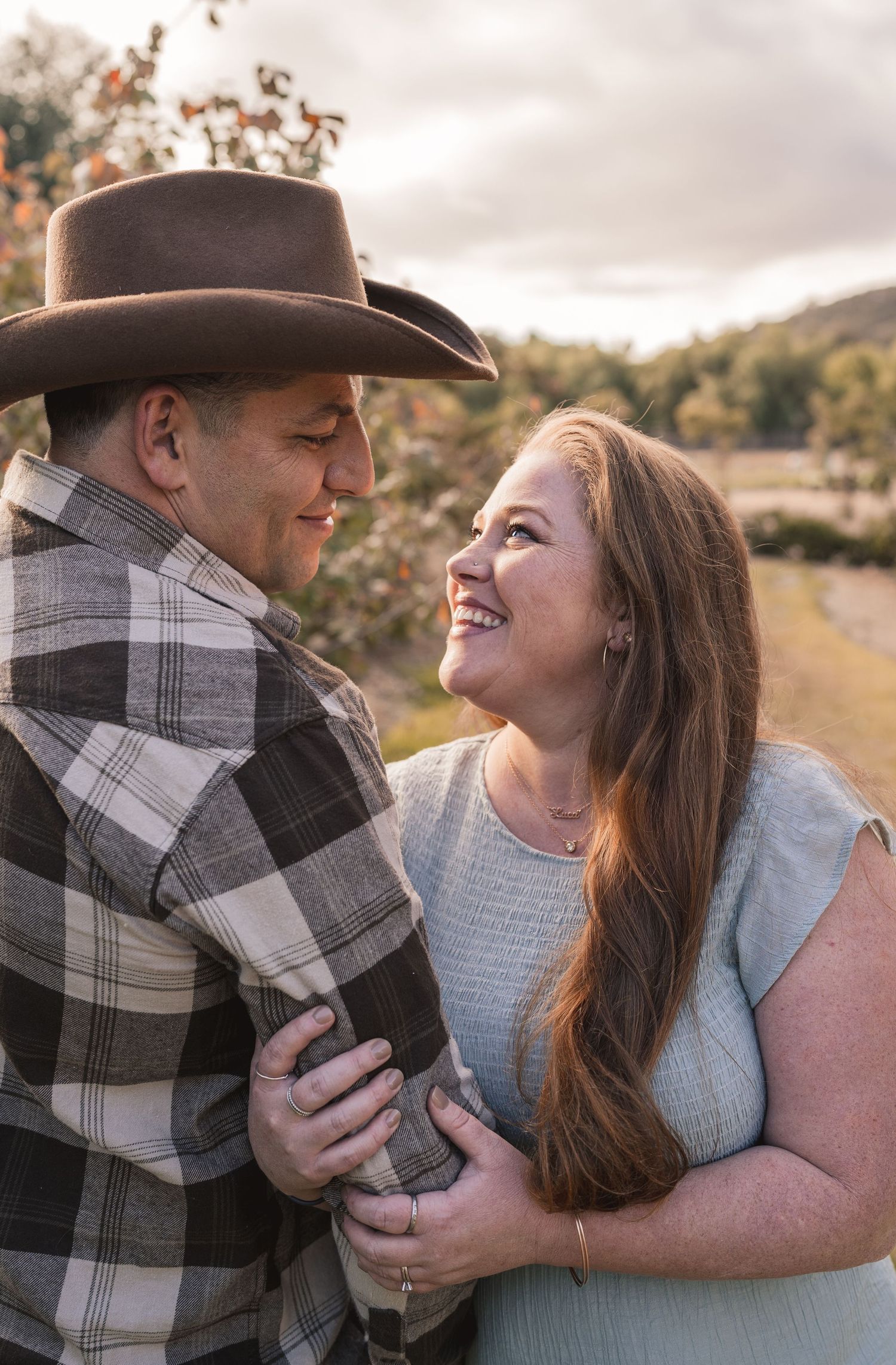 Candid outdoor photoshoot capturing joyful laughter and genuine emotions.