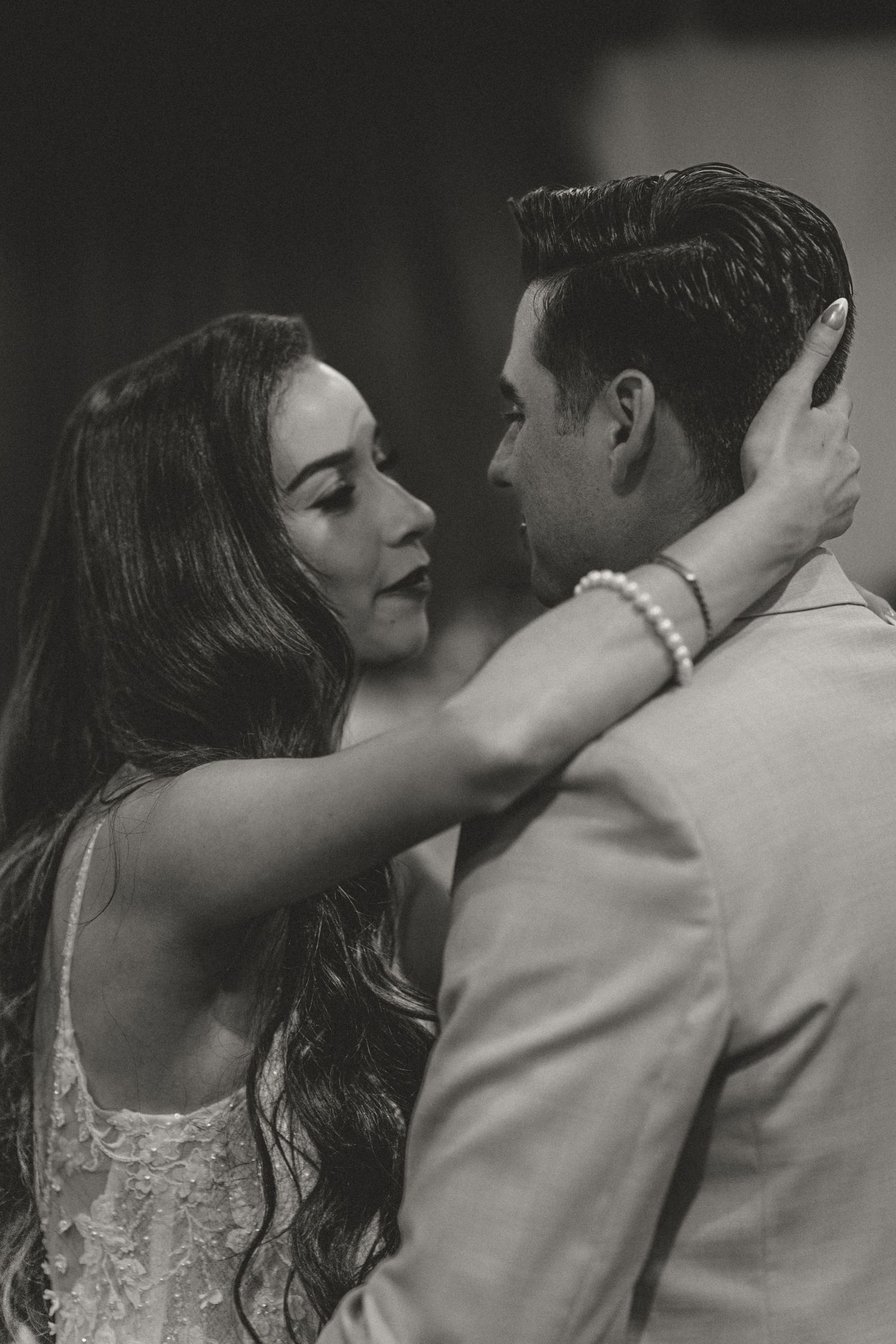 A romantic black and white sequence shows a couple in an intimate embrace and passionate kiss.