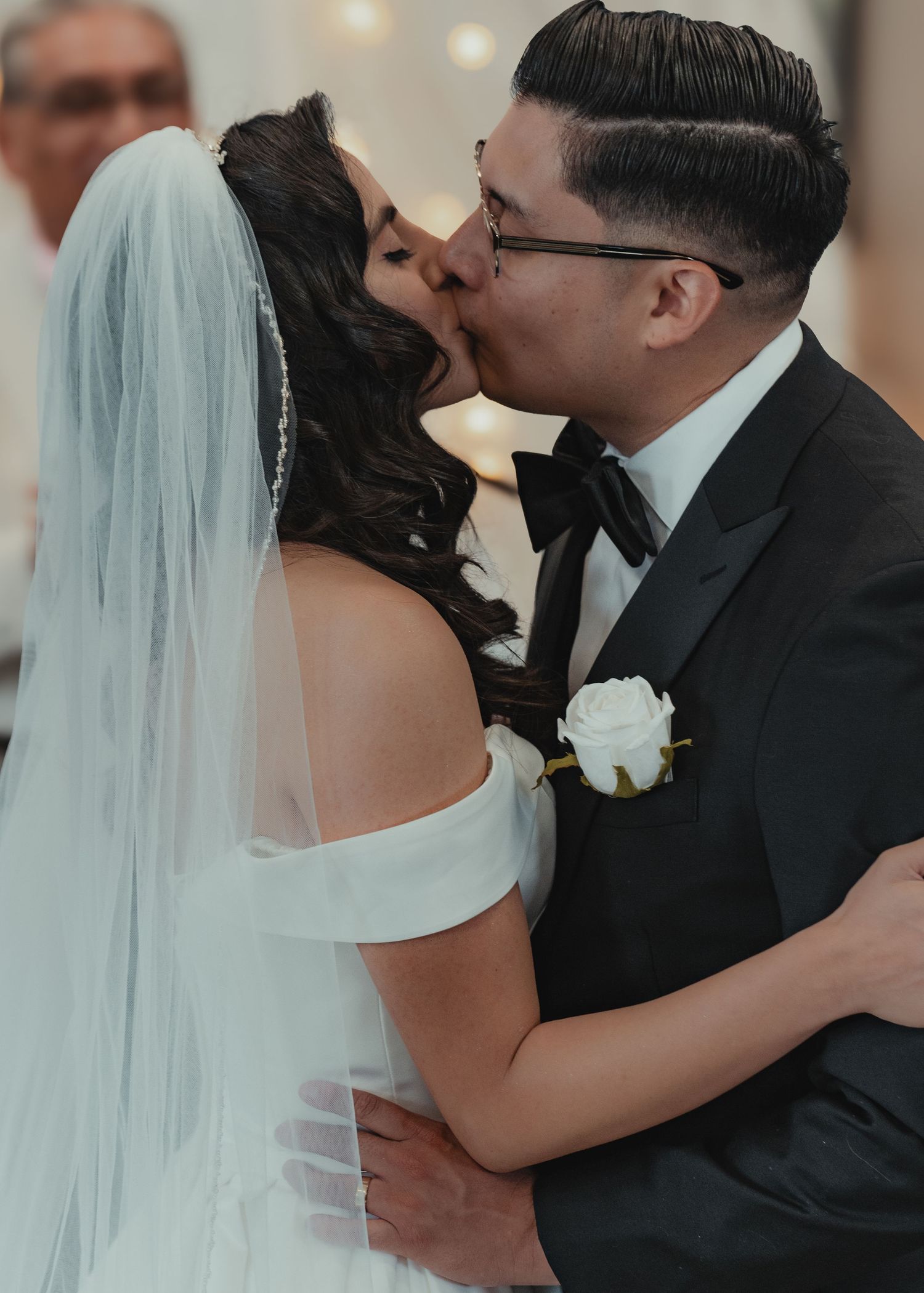 Romantic wedding ceremony moments with bride in flowing veil.