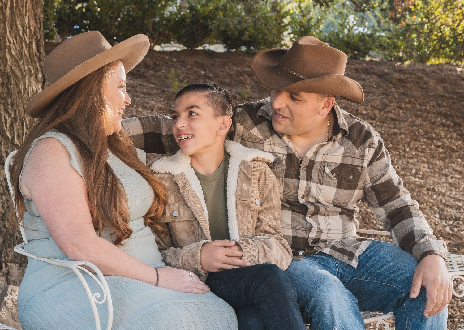 Casual outdoor family photography session with natural poses and expressions.
