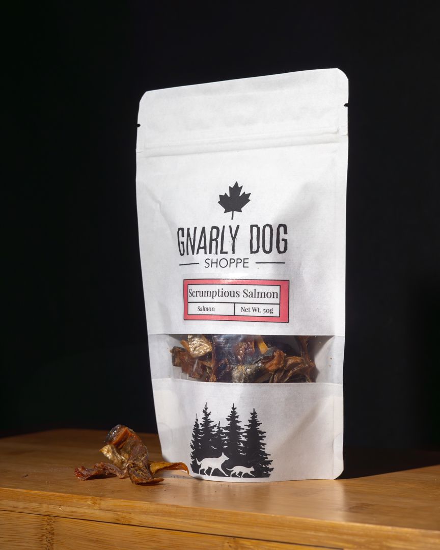 A bag of Gnarly Dog pet treats featuring a Canadian maple leaf logo and forest silhouette design on white packaging.