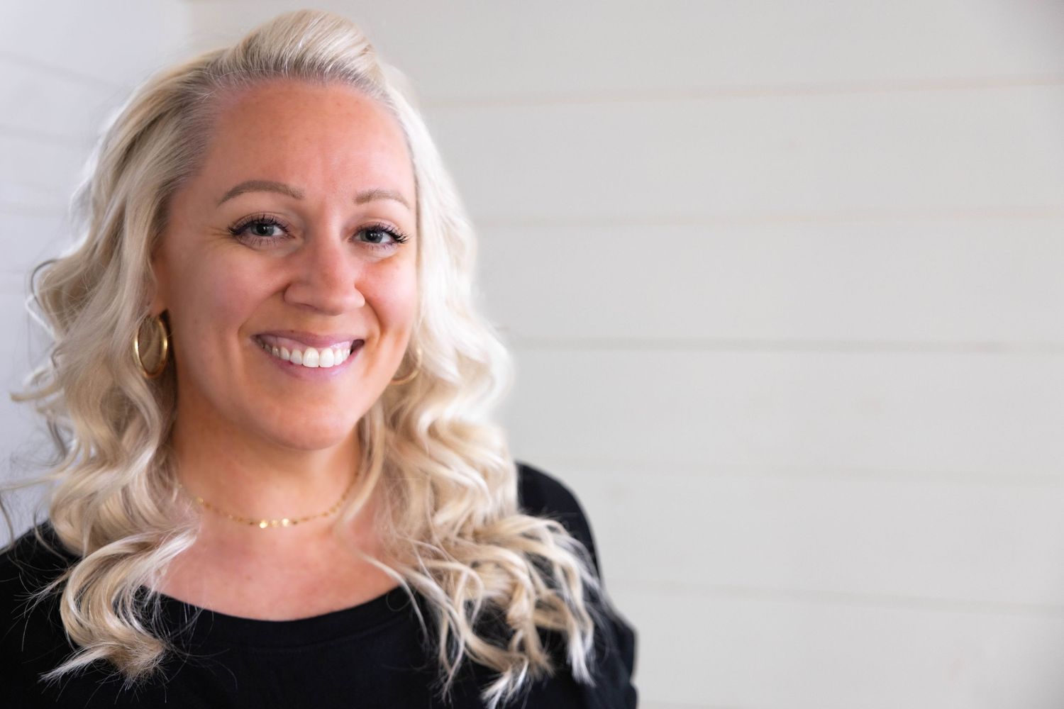 Bright, modern branding session with Lodi photographer Katie Malinda. Natural light headshot with clean background and confident smile.