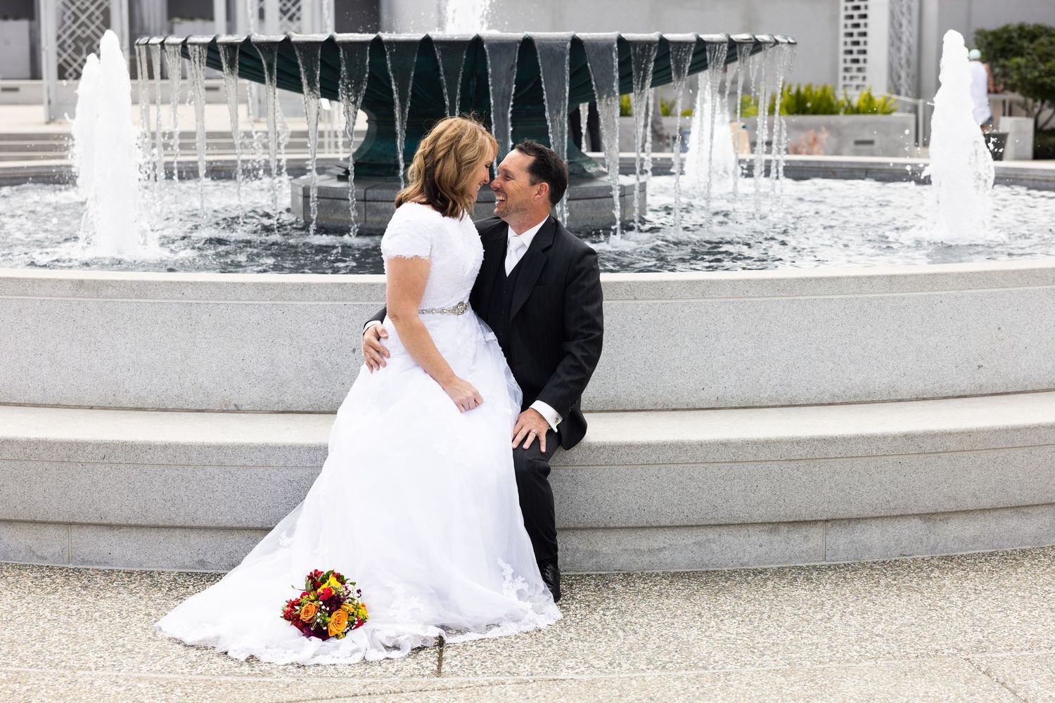 Timeless temple wedding in Oakland, CA captured by Katie Malinda. Romantic fountain backdrop with classic, elegant bridal style.