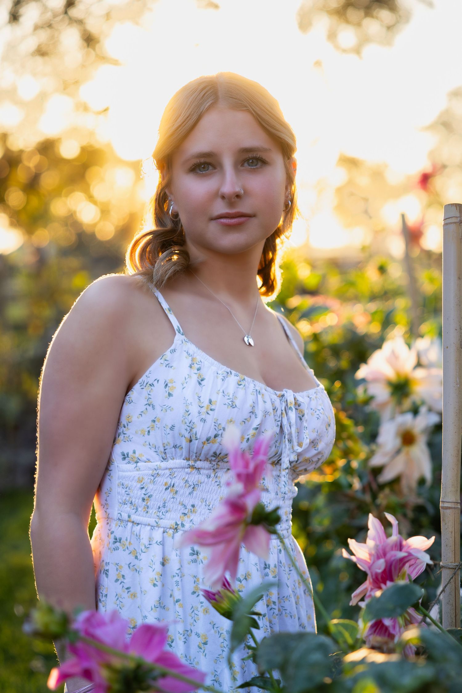 Golden hour glow and floral charm—this Senior radiates confidence, beauty, and a touch of wildflower magic.