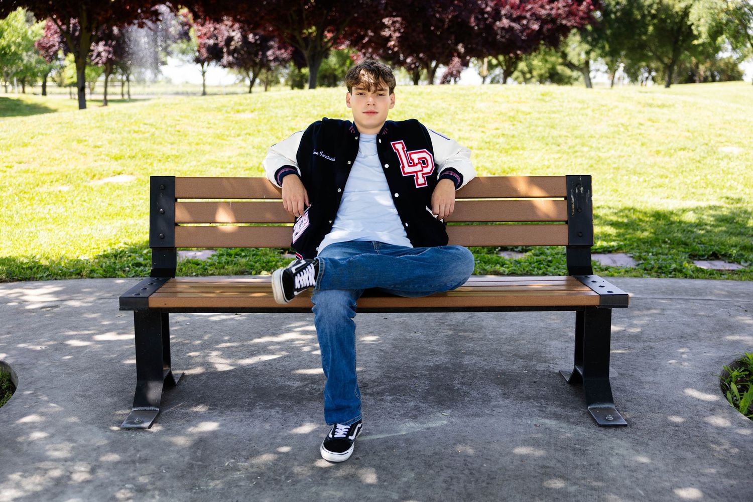 Senior young man sitting on wooden park bench shown from multiple angles and views in connected sequence.
