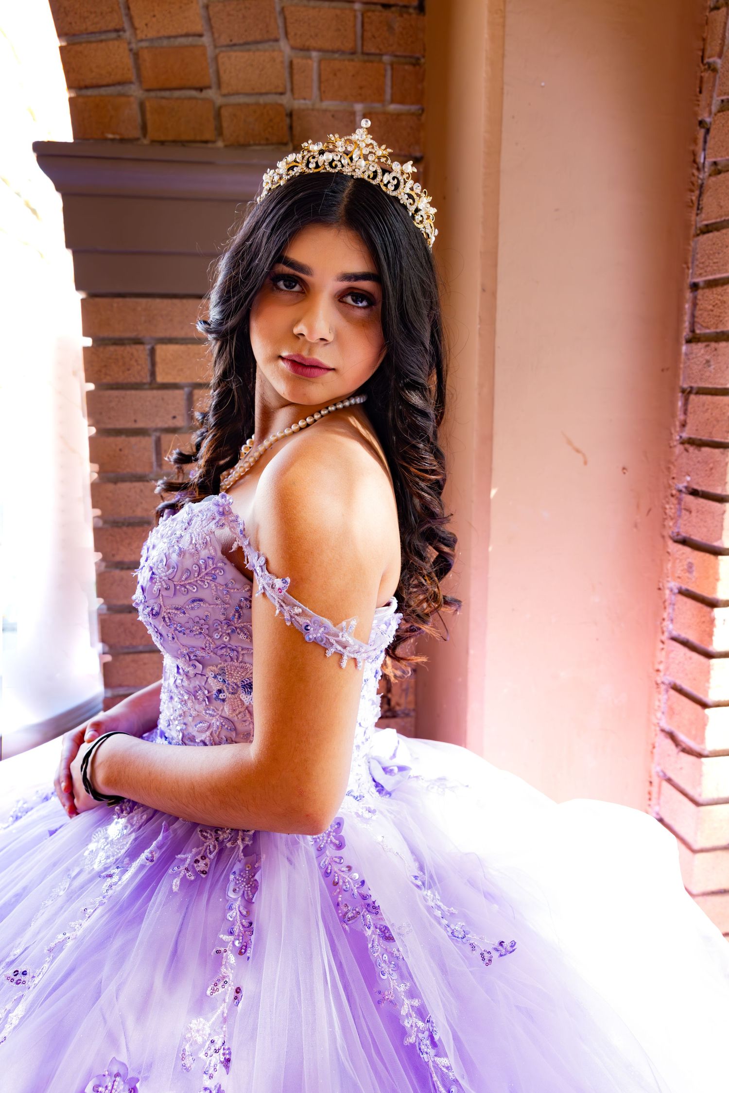 A lavender quinceañera ball gown with delicate off-shoulder details and sparkling embellishments for Sacramento valley photographer, Katie M