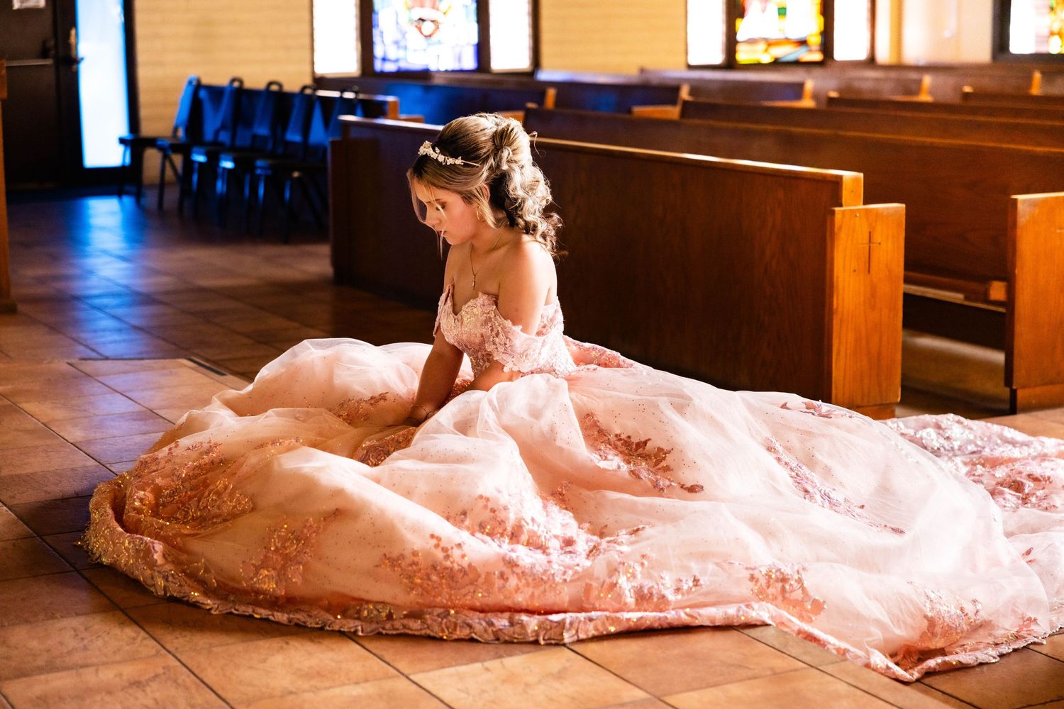Prayers in a church before the quinceañera, family gathers and lodi photographer captures the moment before the party begins.