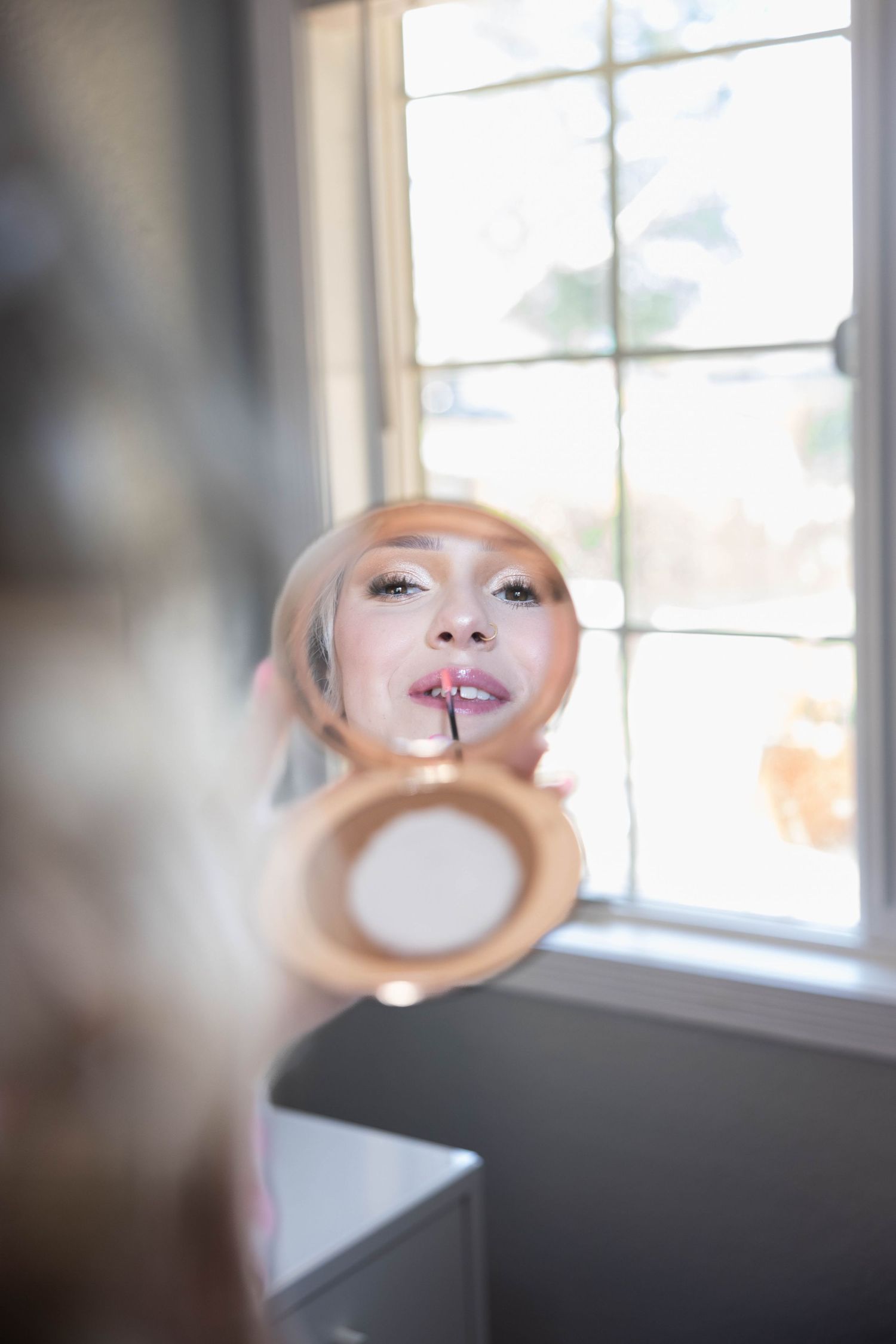 Lodi Quineañera gets ready in her room with glamour makeup and katie malinda photographer snaps a shot during her glow up.