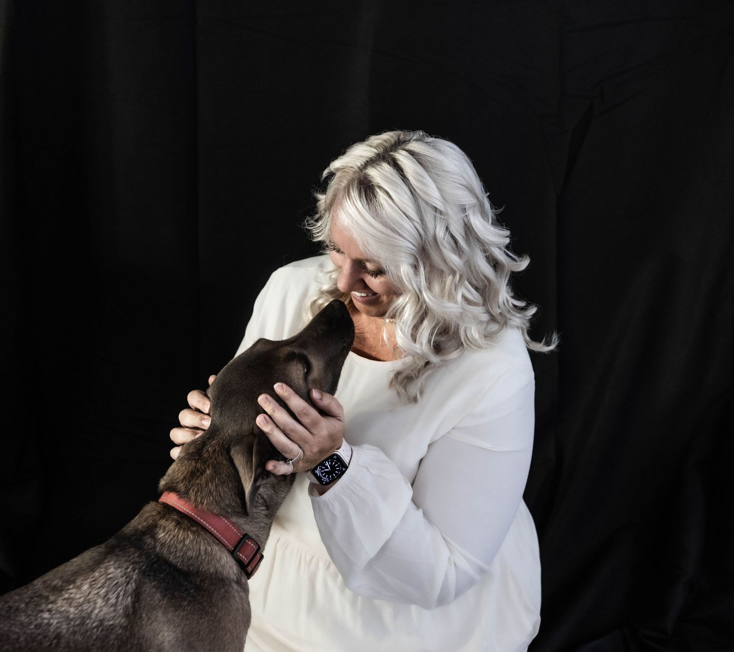 A sweet moment shared—Katie and her pup, captured in pure love and connection. Heart, soul, and a whole lot of tail wags.