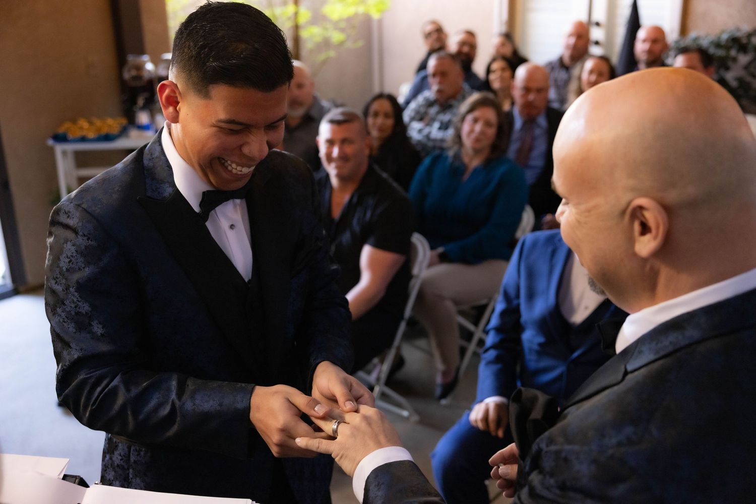 Lodi wedding photographer captures joyful ring exchange at indoor ceremony—authentic moments, candid emotions, and timeless wedding photogra