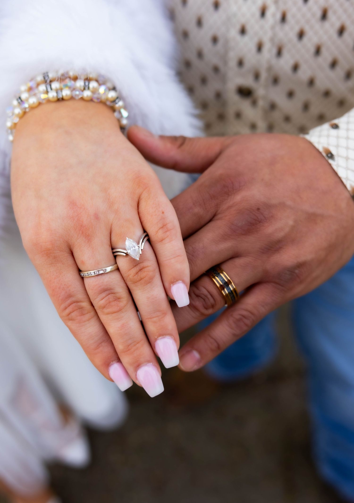 Close-up of bride and groom’s hands and wedding rings—captured by Lodi wedding photographer for timeless, romantic wedding detail photograph
