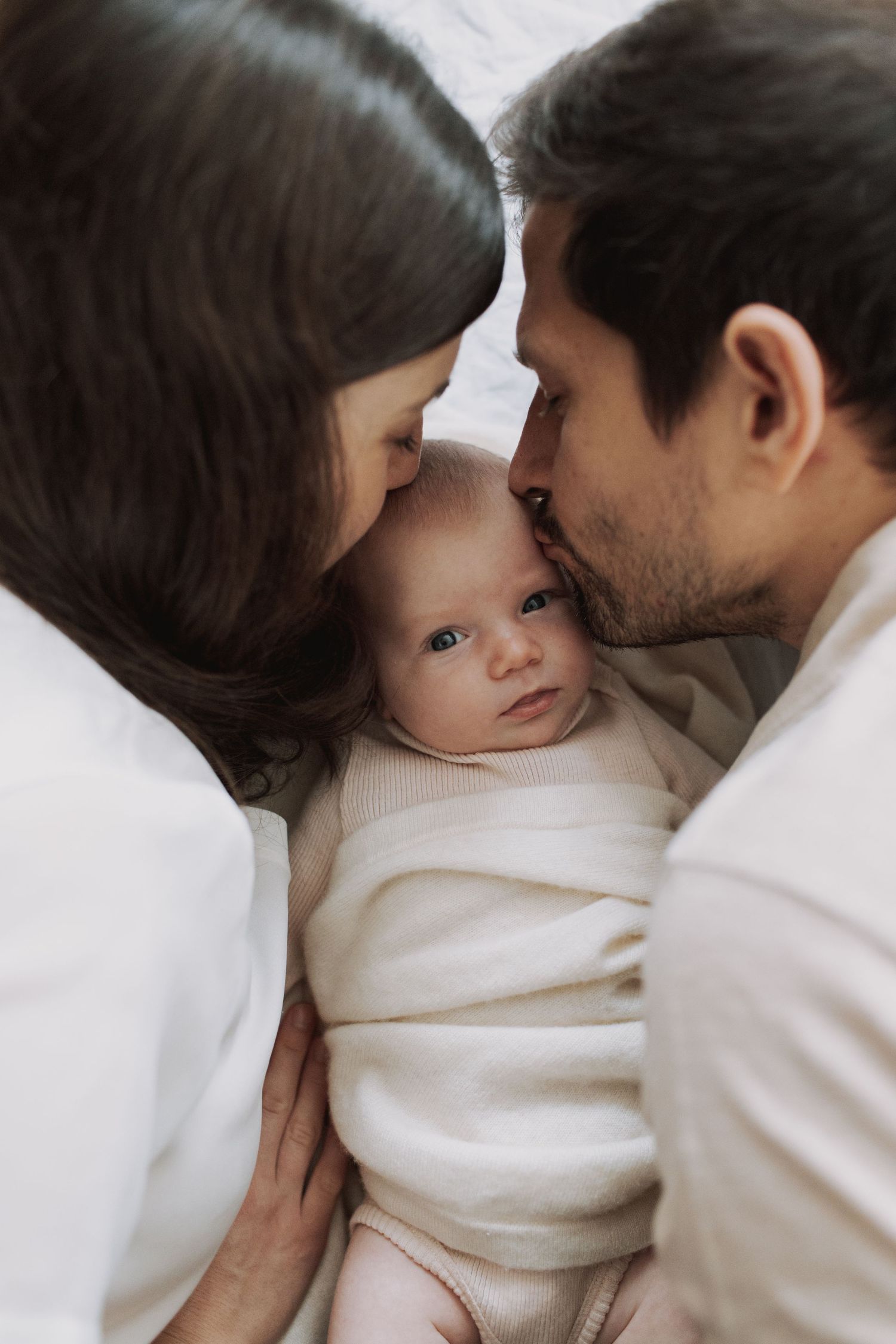 Close-up sequence showing tender family moments and gentle interactions.
