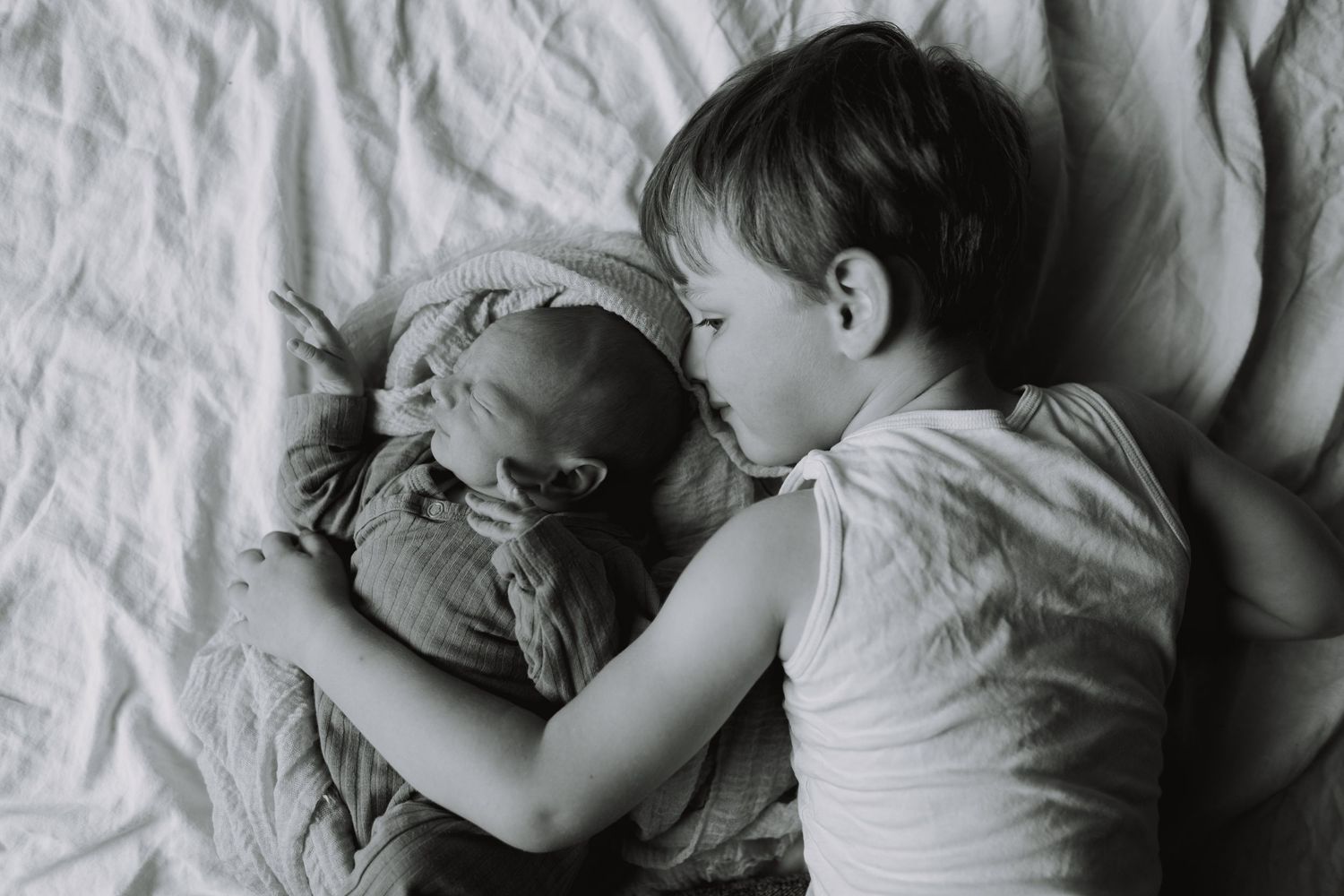 Black and white intimate bedtime sequence showing peaceful rest.