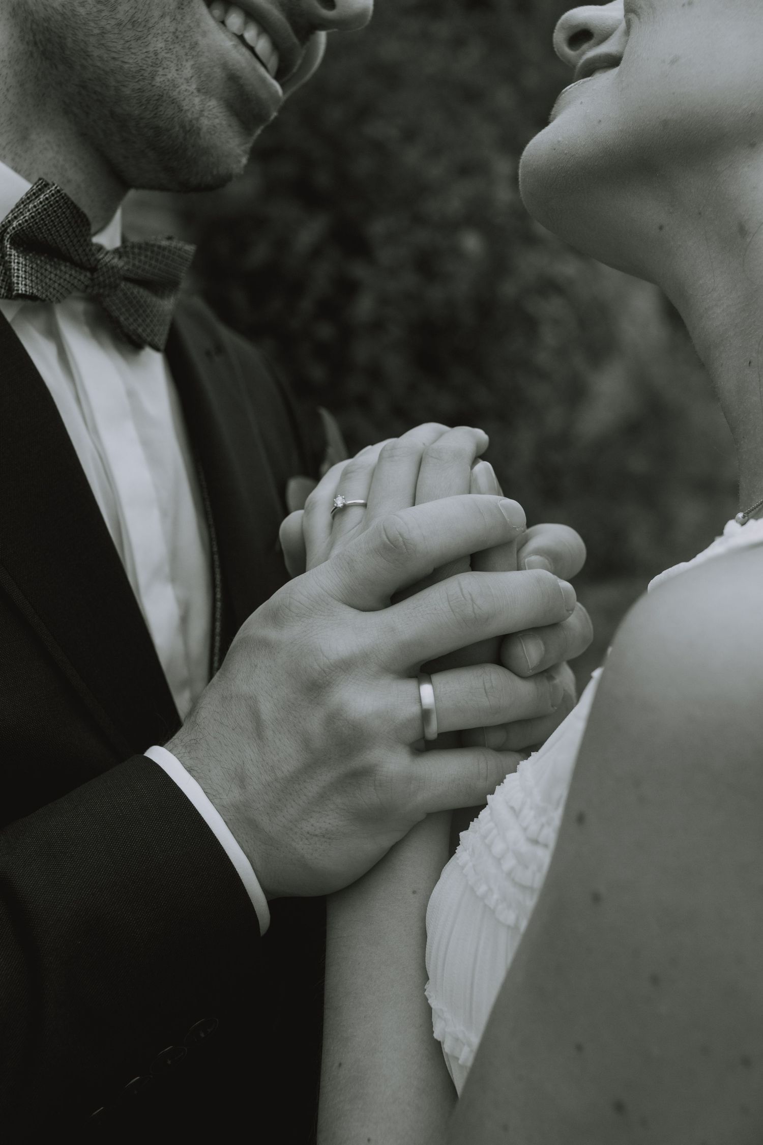 A series of romantic black and white photos showing tender moments between a bride and groom on their wedding day.