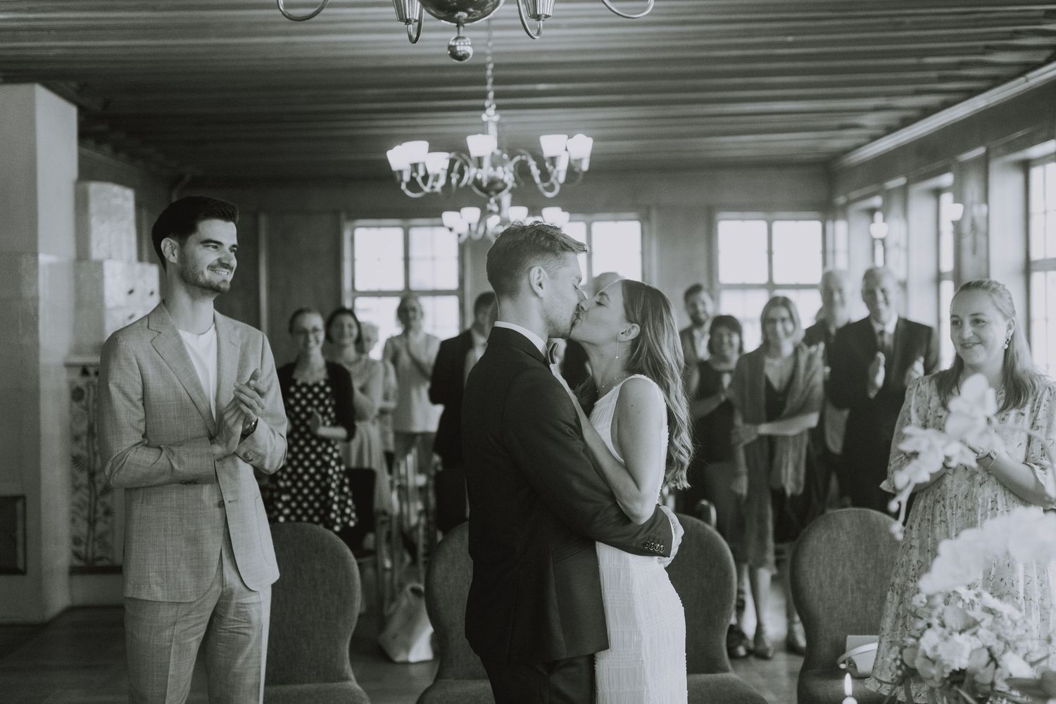 A black and white photo montage shows people dancing and socializing at what appears to be a vintage social gathering.