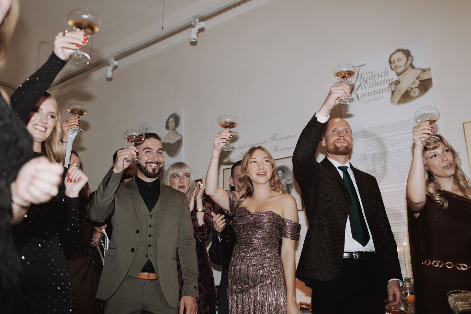 Wedding reception guests dancing and celebrating in an energetic party atmosphere.