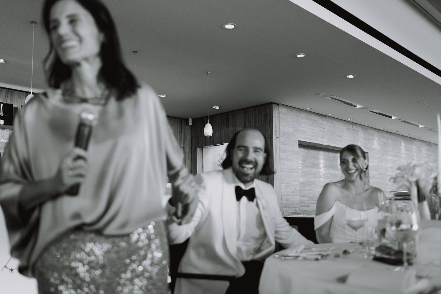 Wedding reception candid moments captured in black and white.