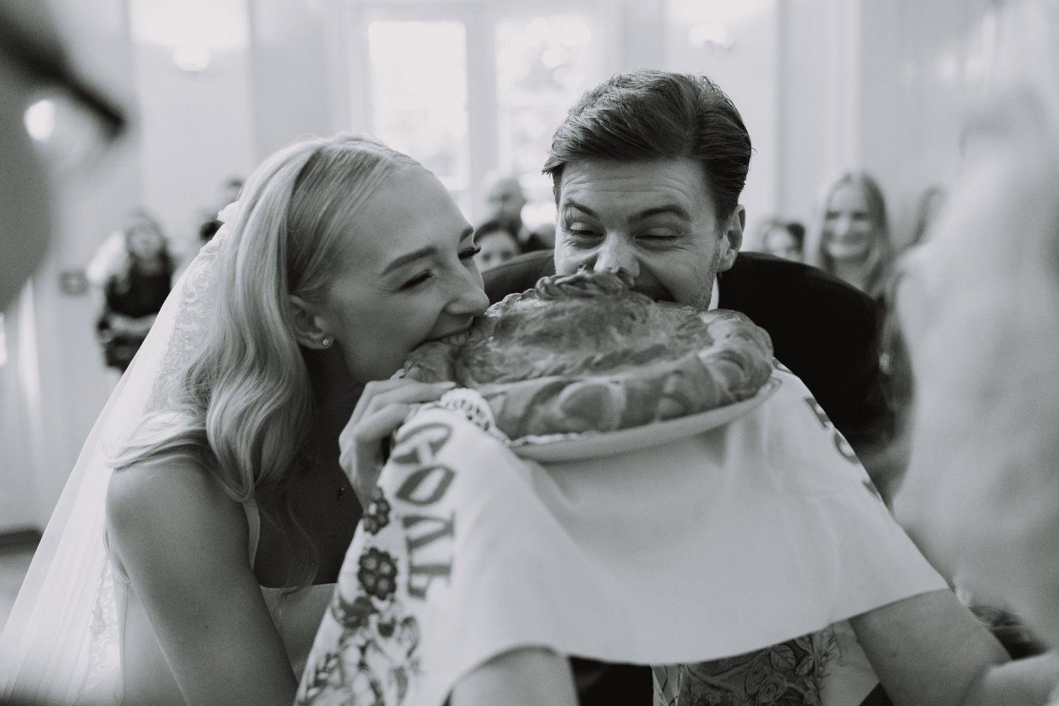 Candid wedding celebration moments captured in black and white photography.