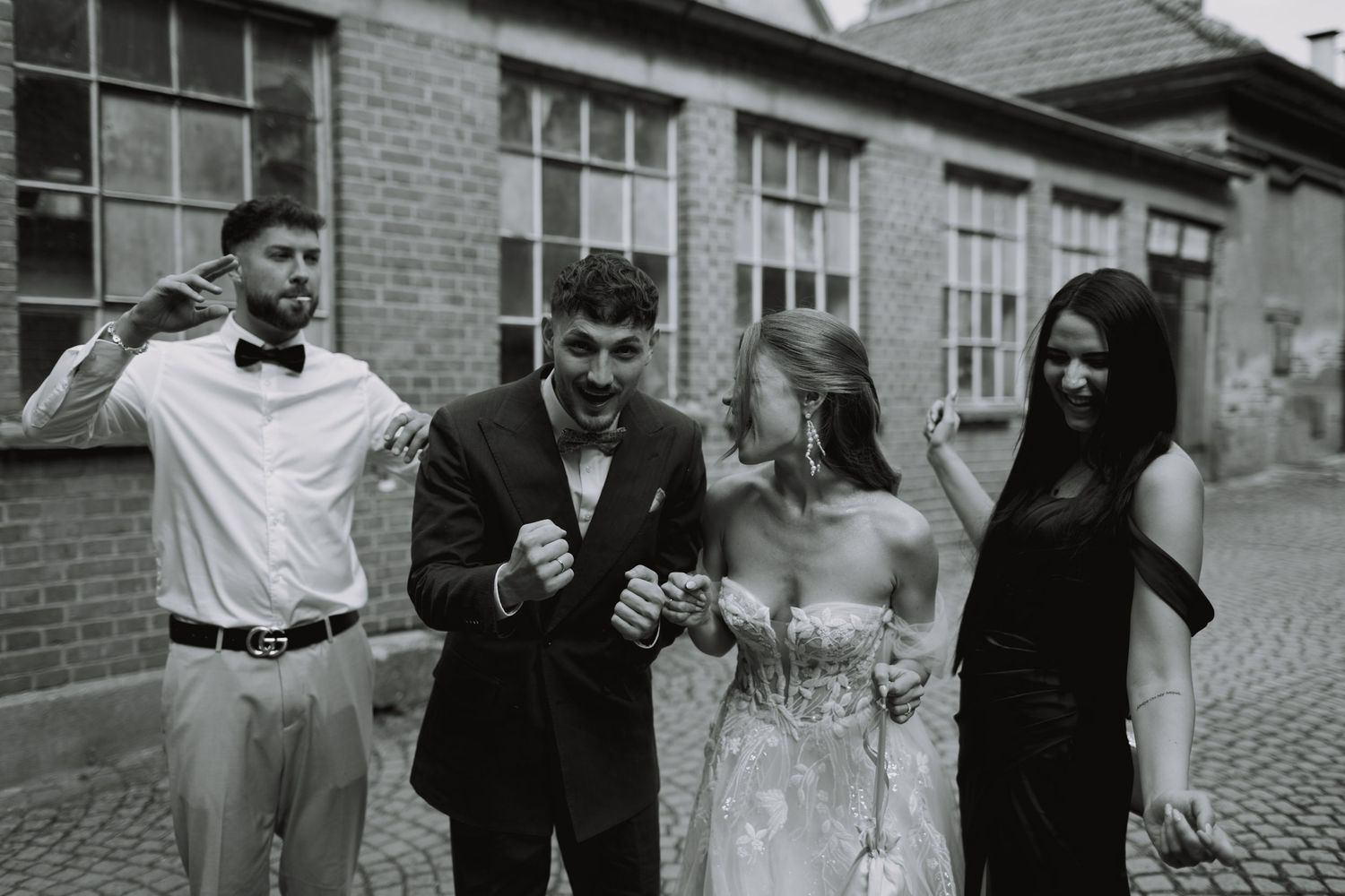 A wedding celebration sequence showing dancing and joy outside a brick building.