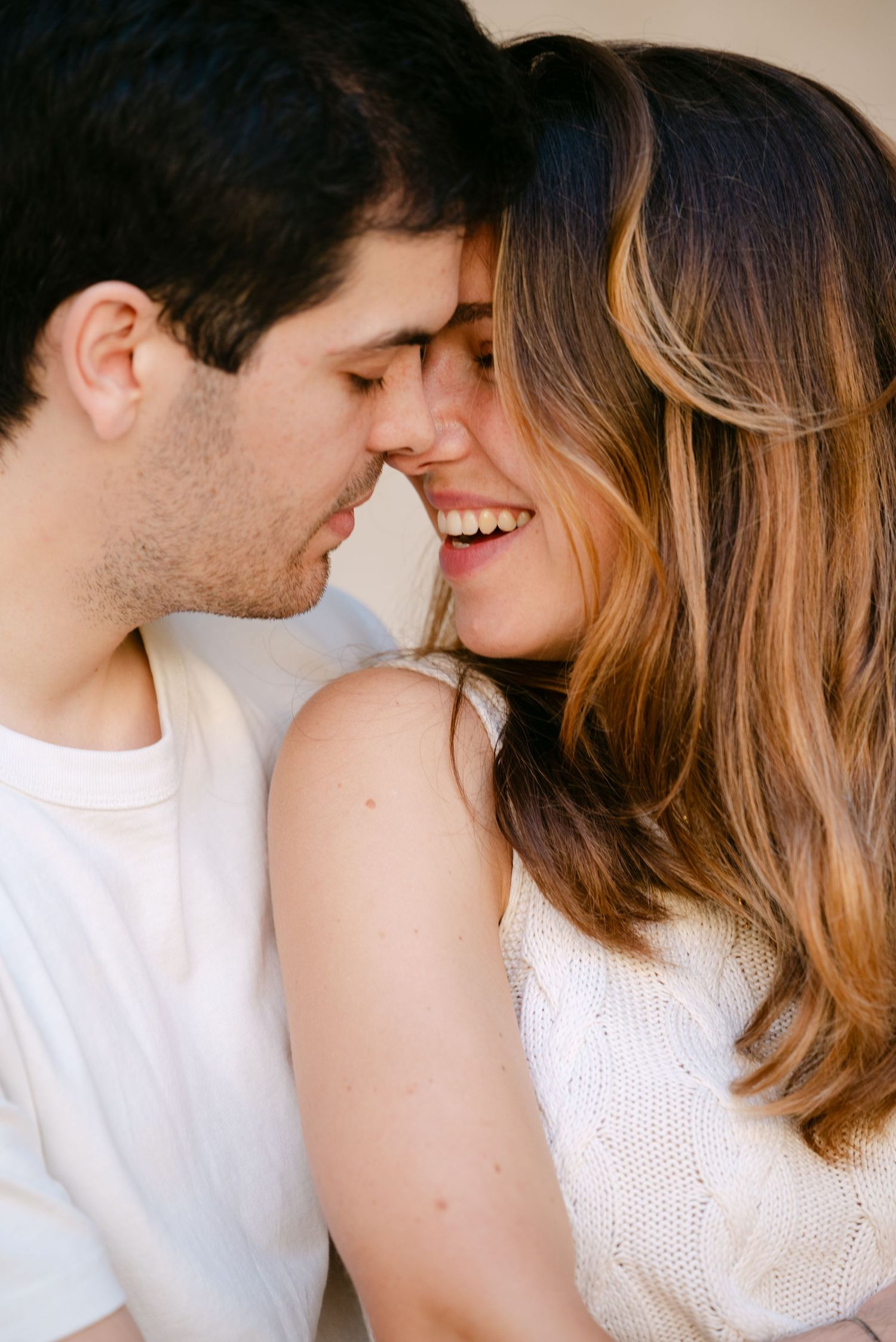 Close-up of bride and groom sharing a romantic kiss, captured in Tuscany, Italy, during an emotional wedding moment.