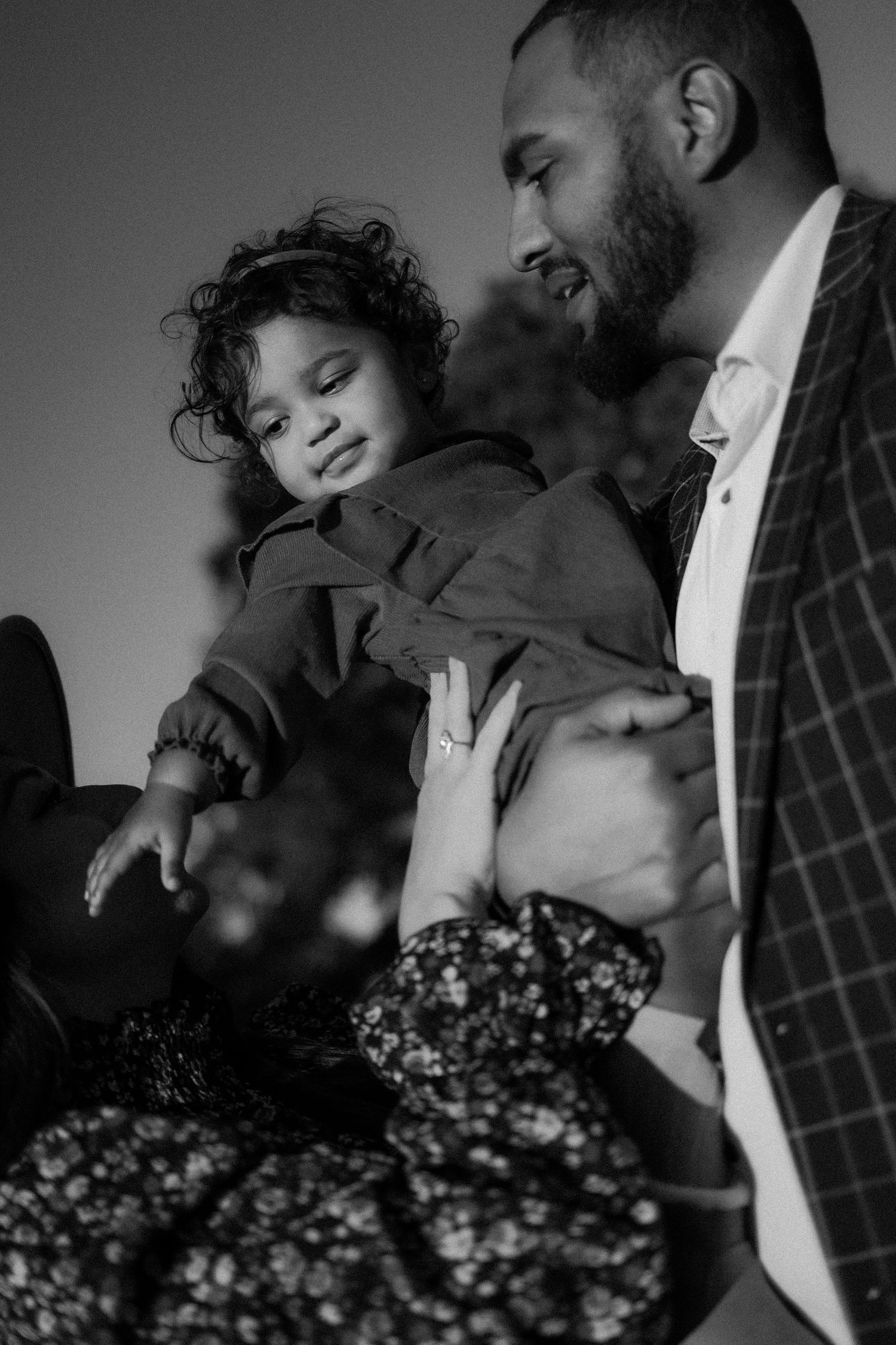 family photoshoot, black and white, baby girl with mom and dad