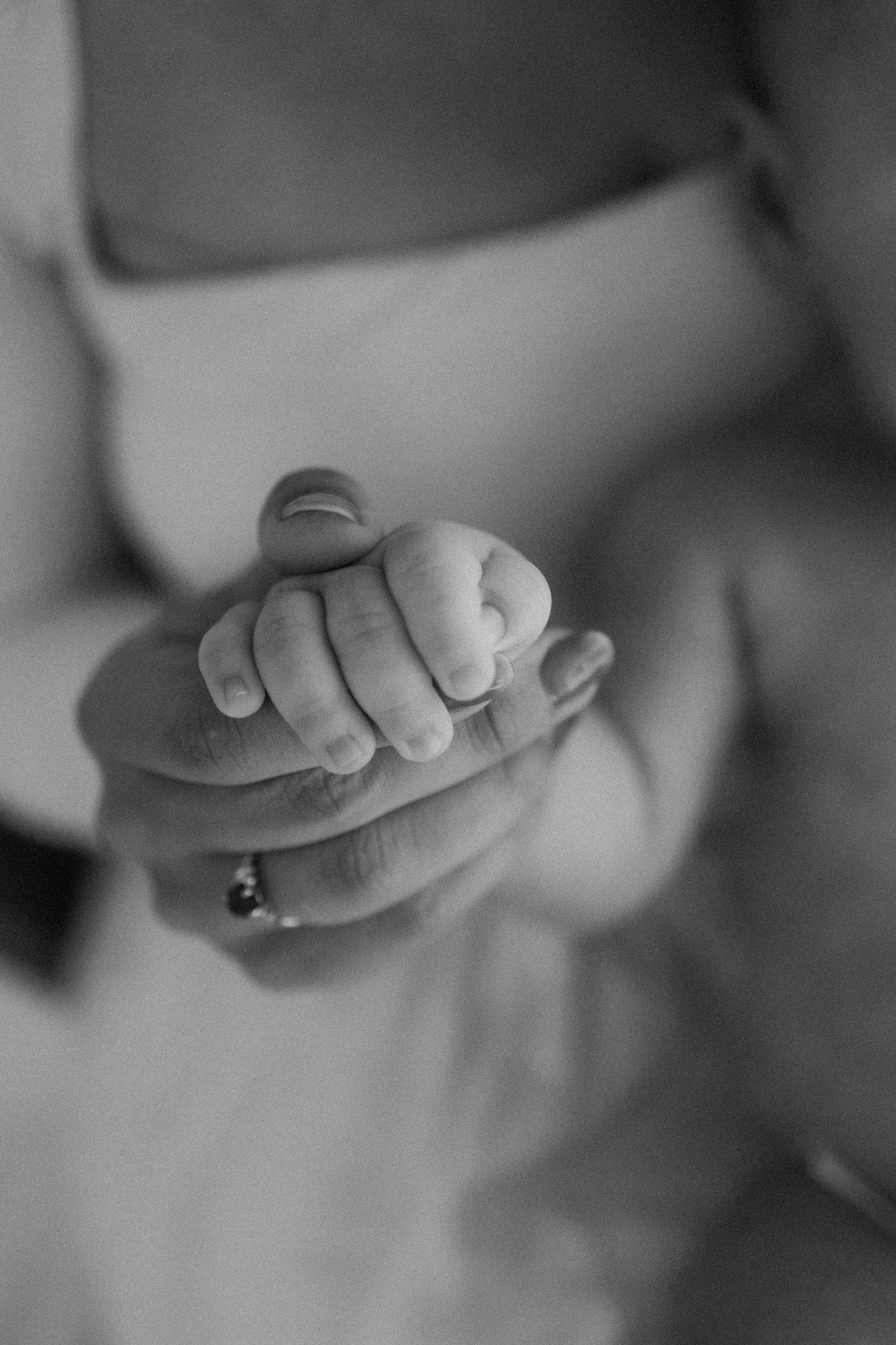 detail photography, holding hands, mother and son, black and white