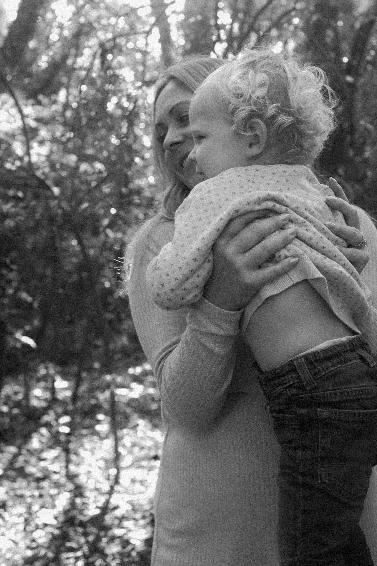 mother and son candid photograph black and white