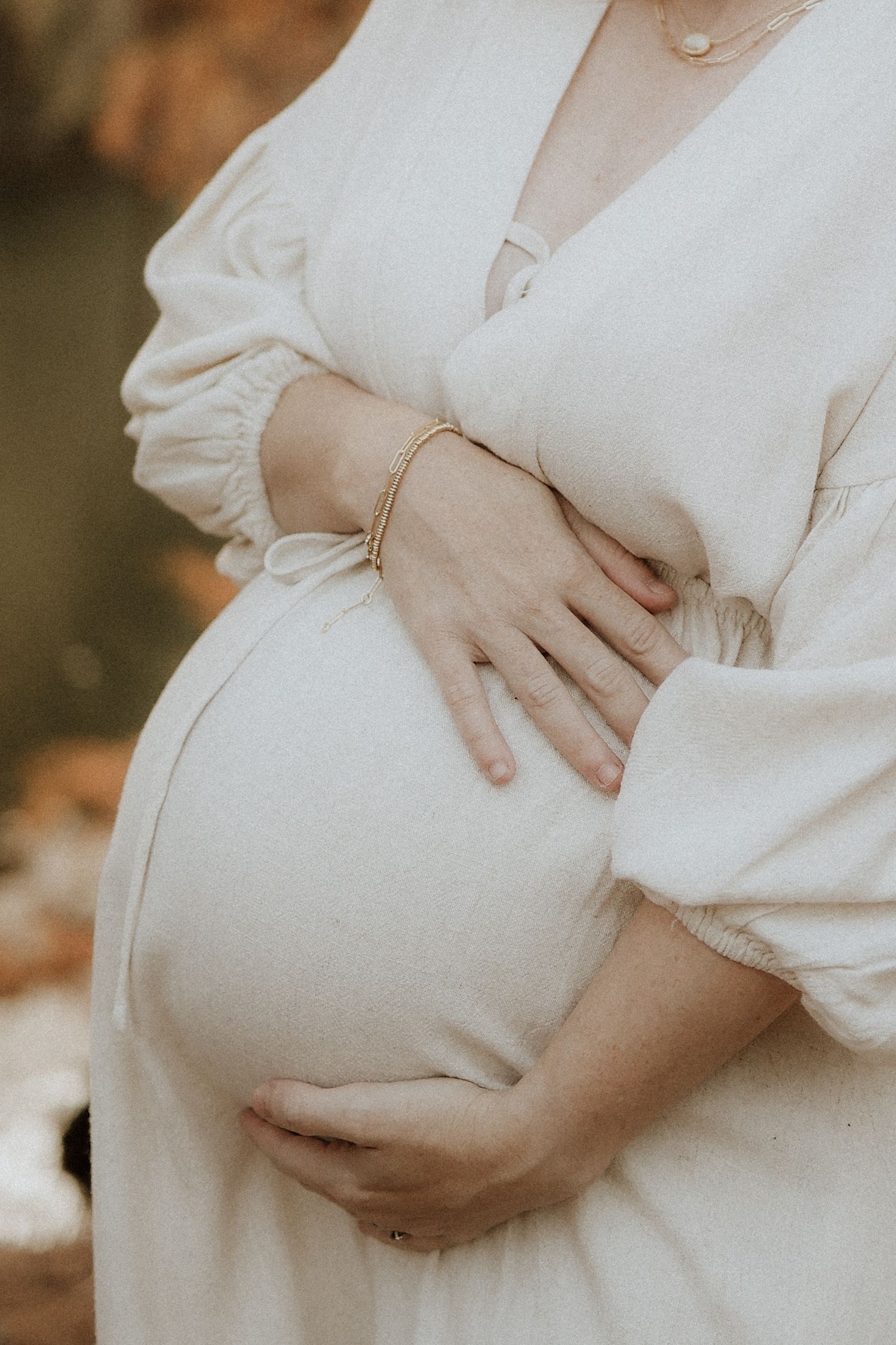 baby bump detail, hands, maternity