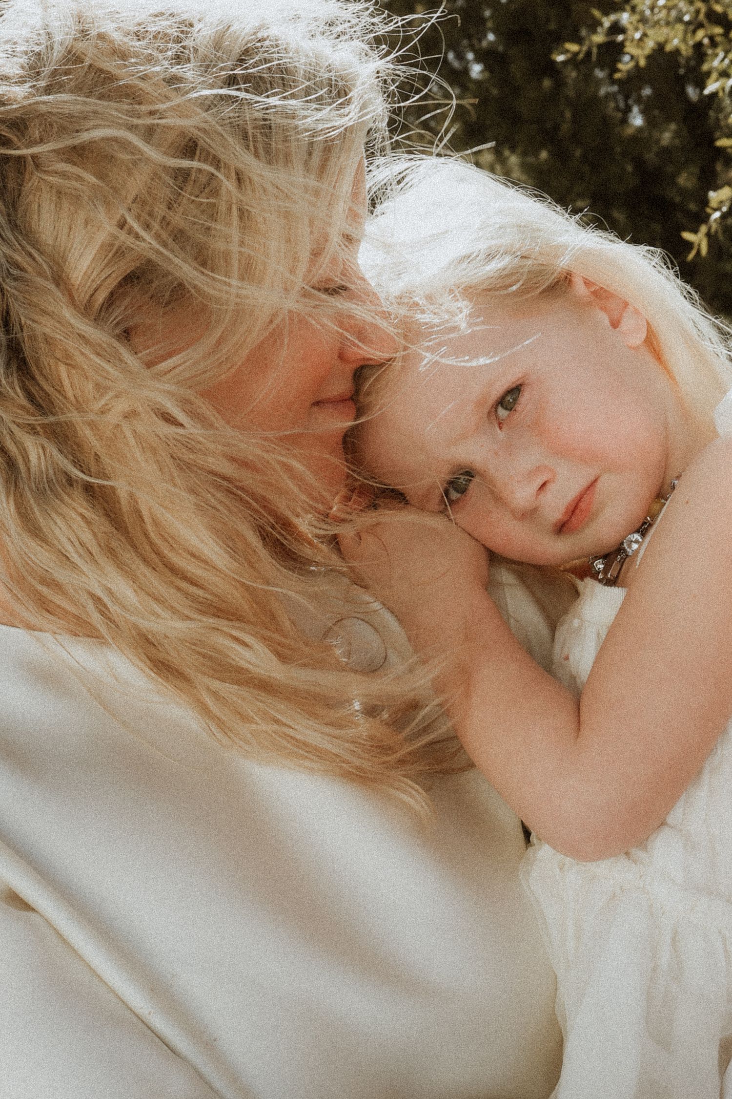mom and daughter candid portrait close up
