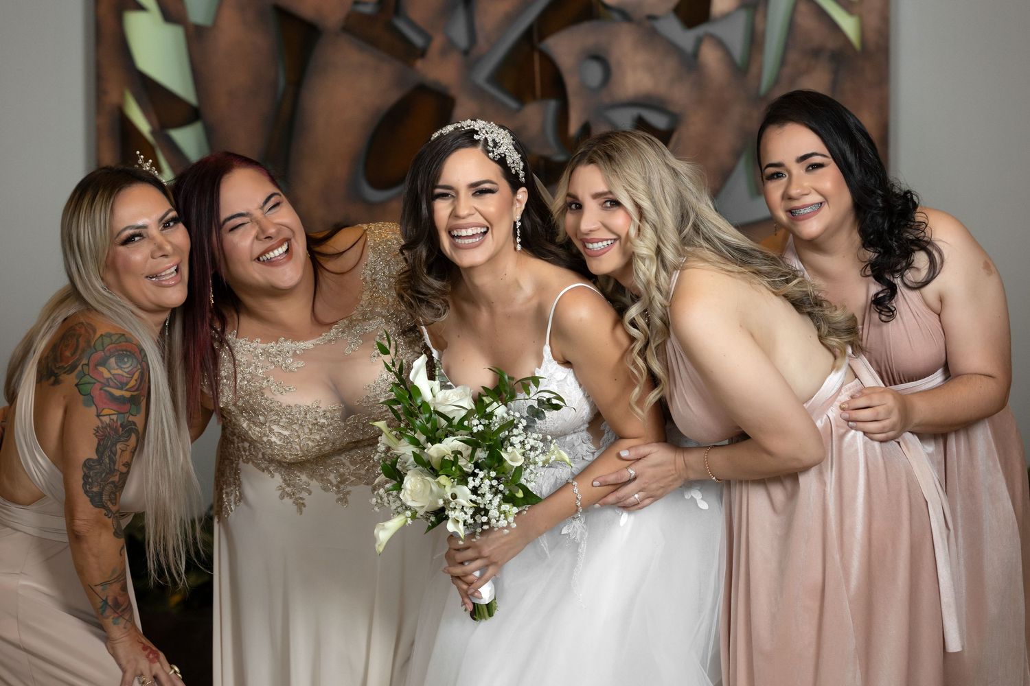 Bride with bridesmaids in blush and champagne dresses — wedding photographer Puerto Rico Raymond Vega