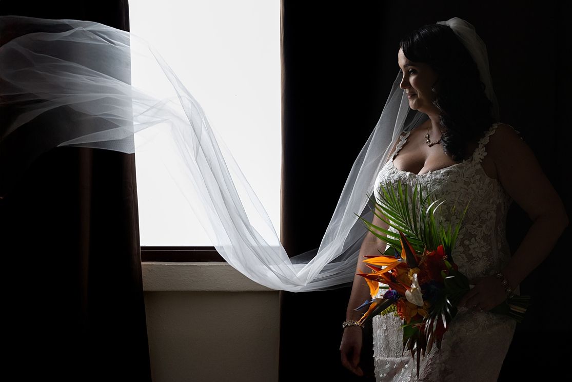 Dramatic bride portrait with flowing veil at Hotel Guajataca Puerto Rico — wedding photographer Raymond Vega