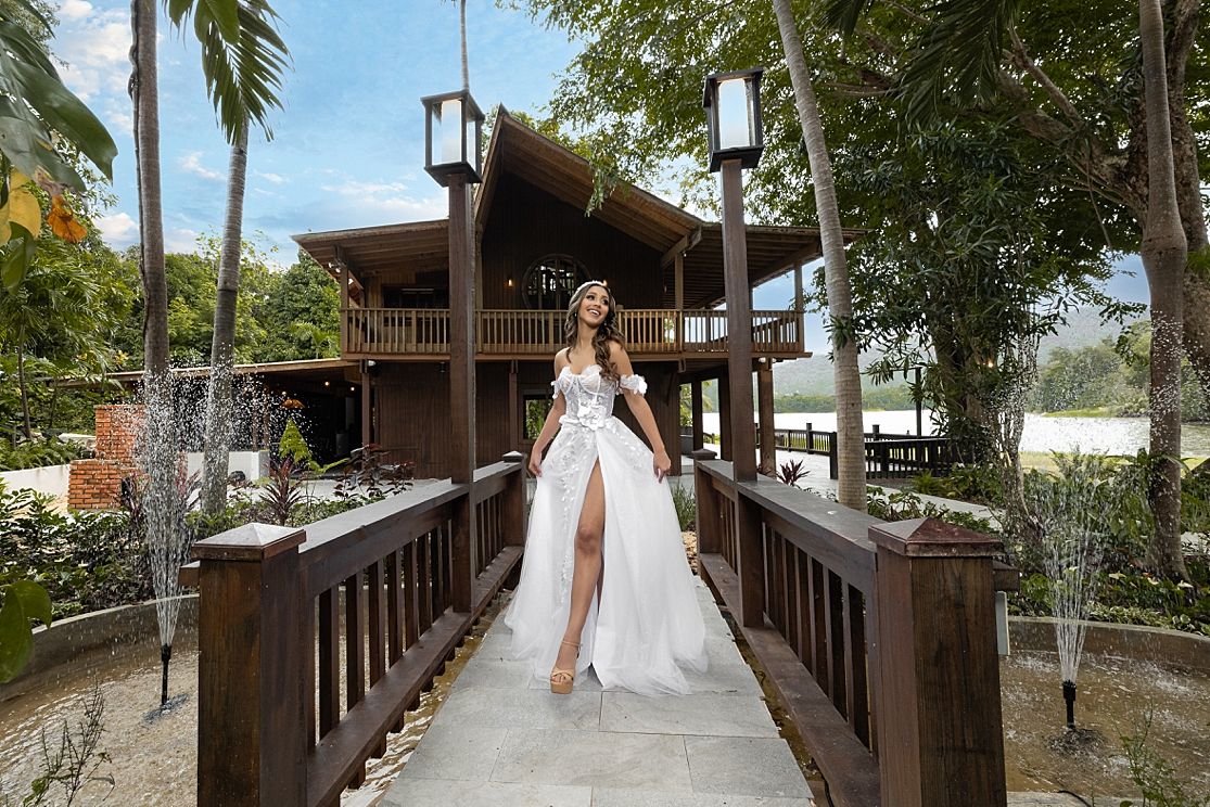 Bride portrait on wooden bridge tropical garden Puerto Rico — destination wedding photographer Raymond Vega
