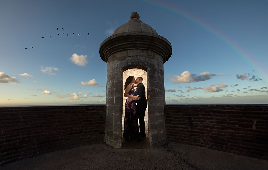Bride and groom silhouette in historic garita at sunset Old San Juan Puerto Rico — wedding photographer Raymond Vega