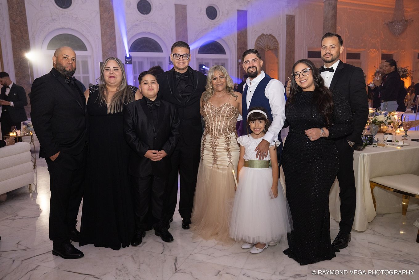 Family group photo at an elegant formal event, posing together in a grand decorated venue.Antiguo Casino Puerto Rico wedding