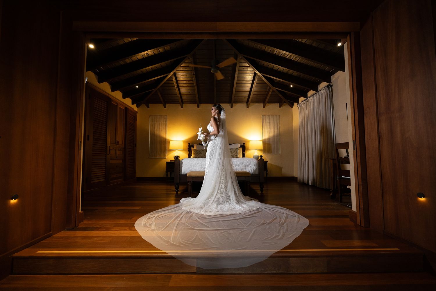Bride walking through elegant wooden corridor — destination wedding photography Royal Sonesta San Juan Puerto Rico Raymond Vega