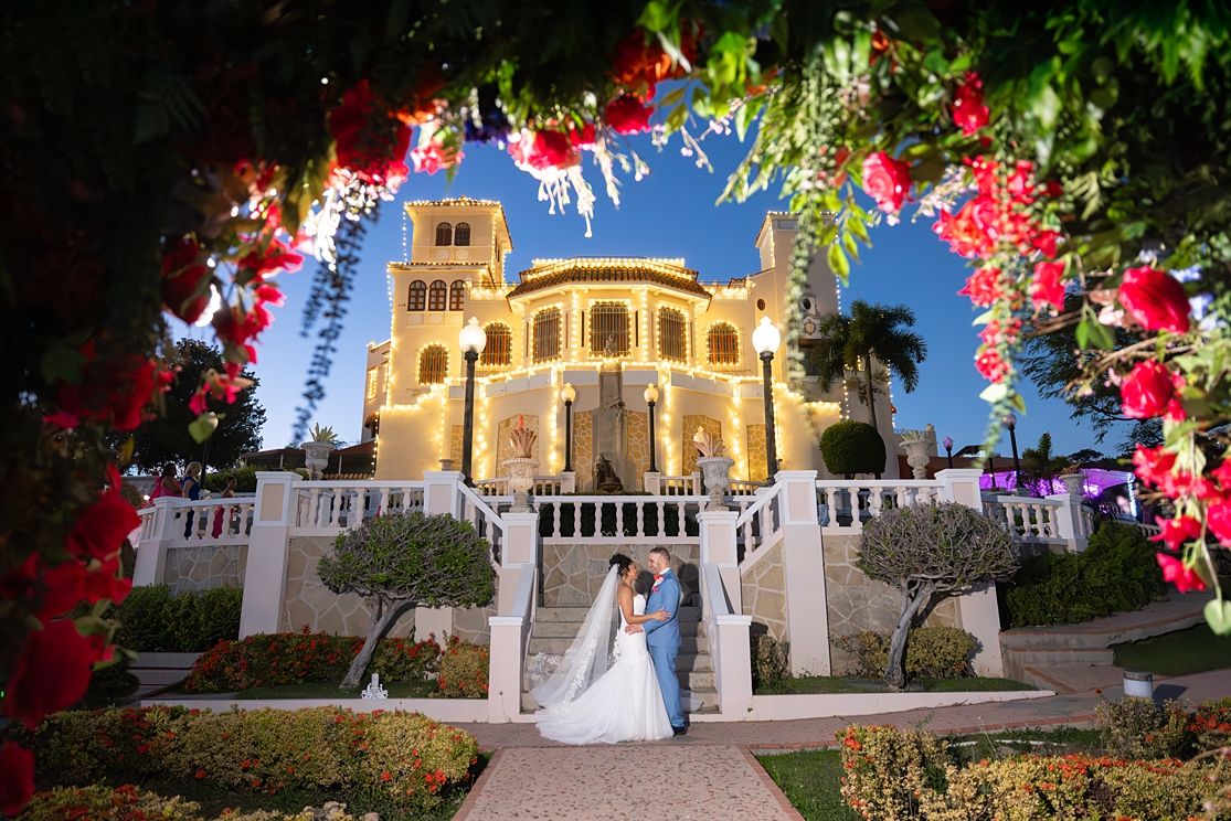 Wedding couple at Castillo Serrallés Ponce Puerto Rico at night — destination wedding photographer Raymond Vega