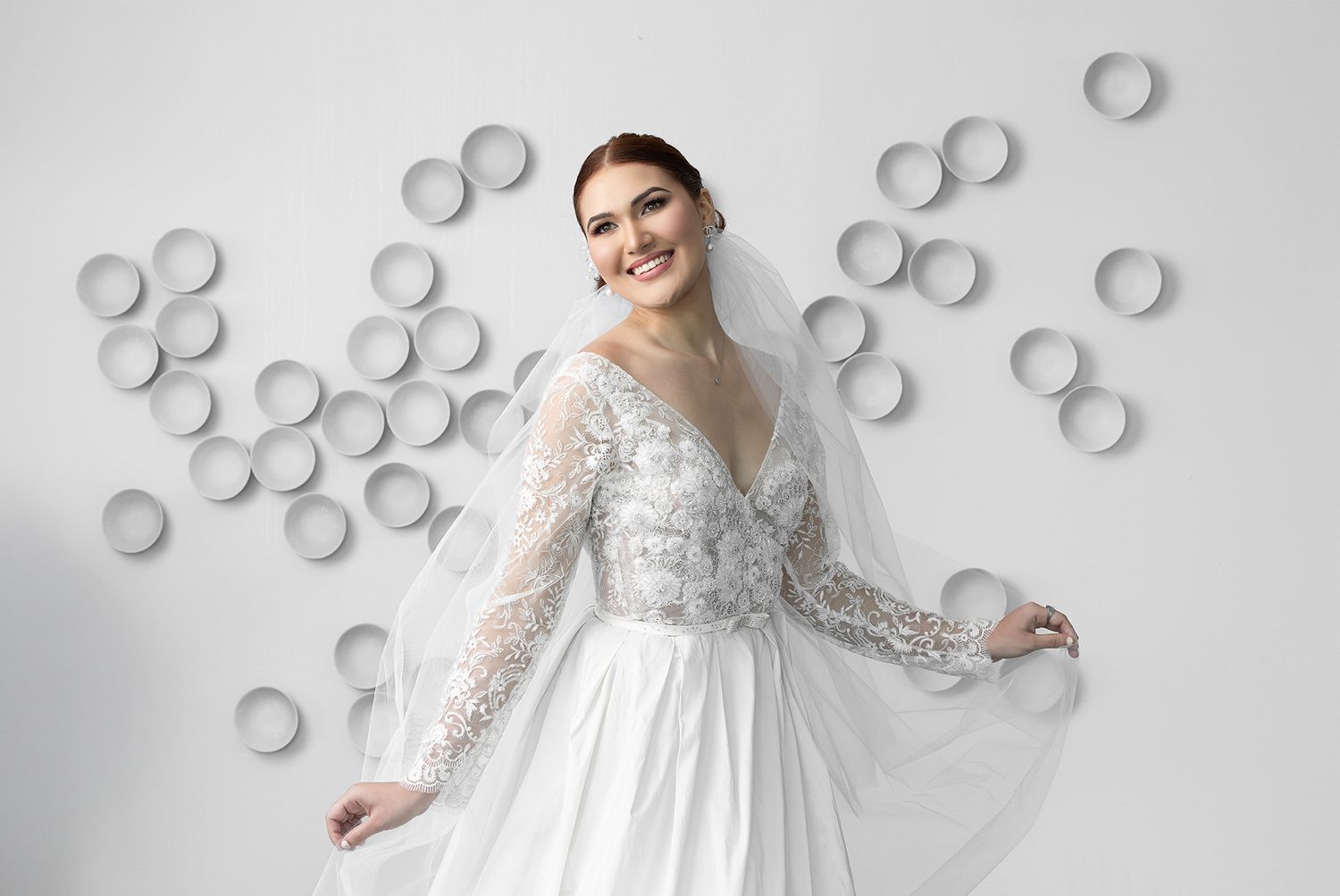 Elegant bride portrait with artistic white circle backdrop — destination wedding photographer Puerto Rico Raymond Vega