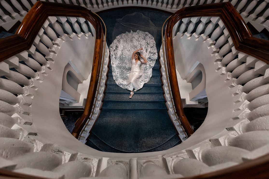 Aerial staircase bridal portrait — creative destination wedding photographer Puerto Rico Raymond Vega Photography + Cinema