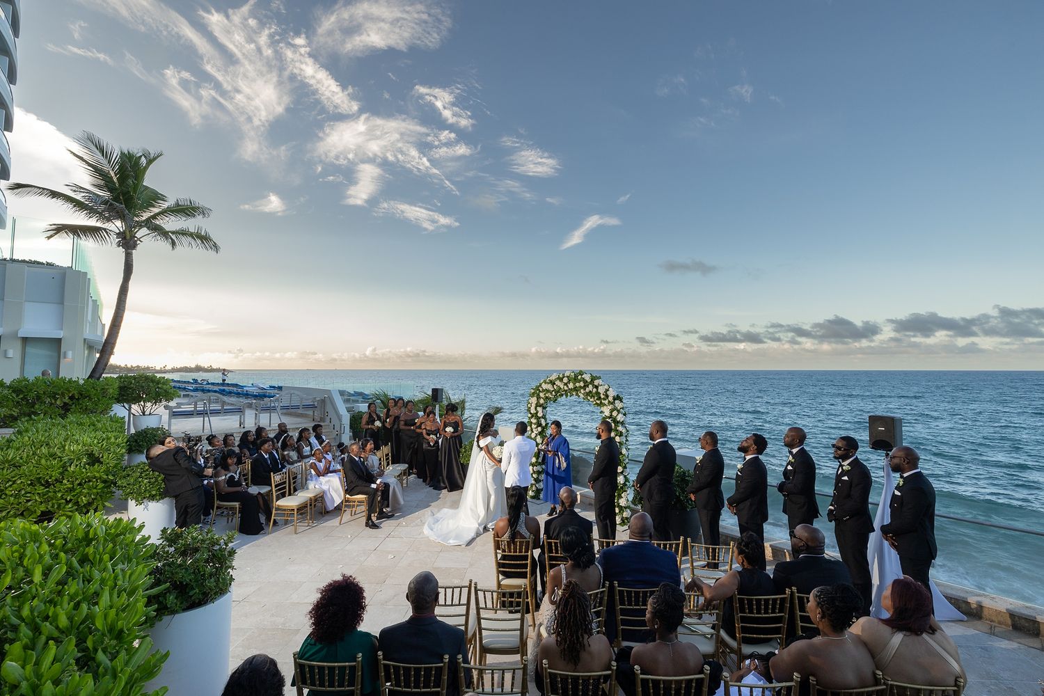 Outdoor wedding ceremony oceanfront terrace Puerto Rico — destination wedding photographer Raymond Vega