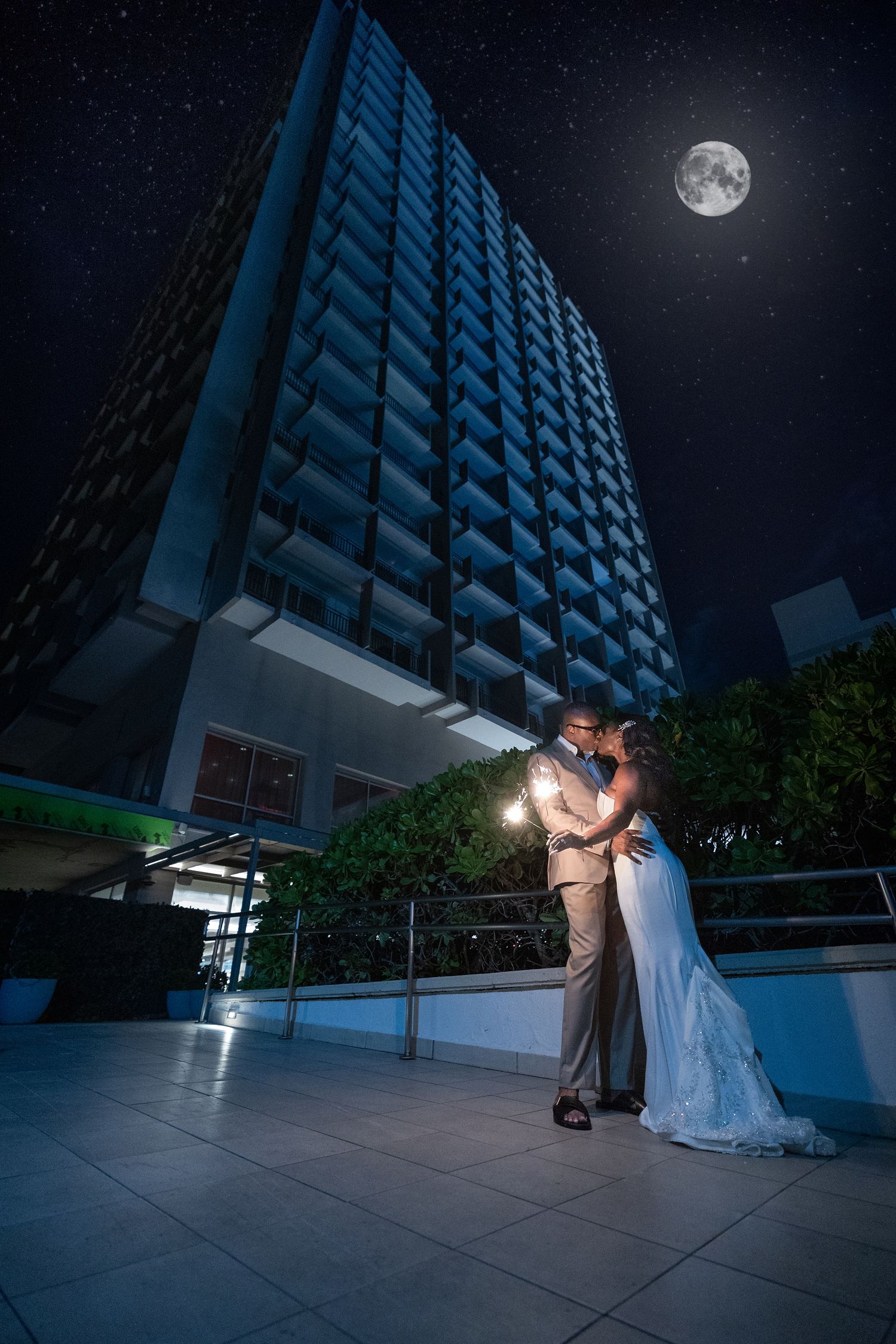 Bride and groom kissing under the moonlight on the rooftop of Marriott Renaissance San Juan, Puerto Rico — Raymond Vega Photography + Cinema