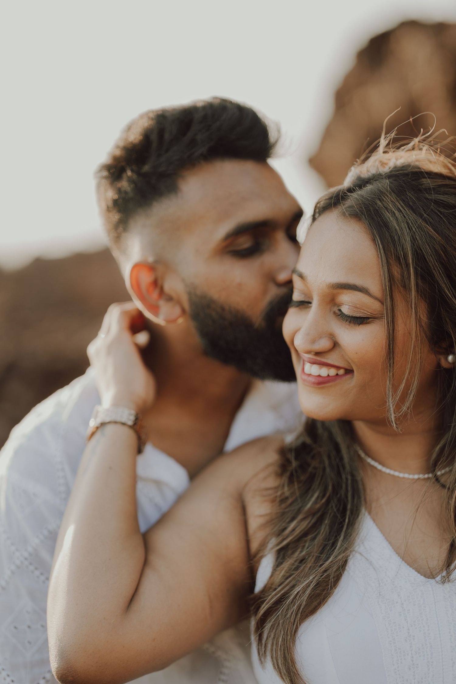 Romantic couple sharing intimate moments in a series of close-up portraits at sunset.