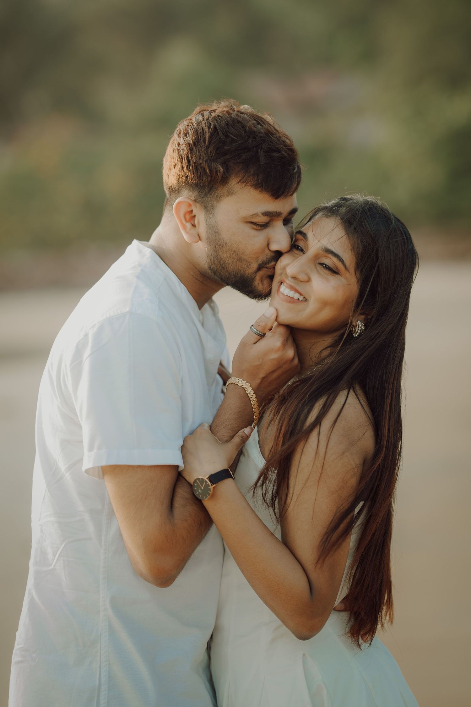 A romantic couple shares intimate kisses in a series of connected photos with soft natural lighting outdoors.