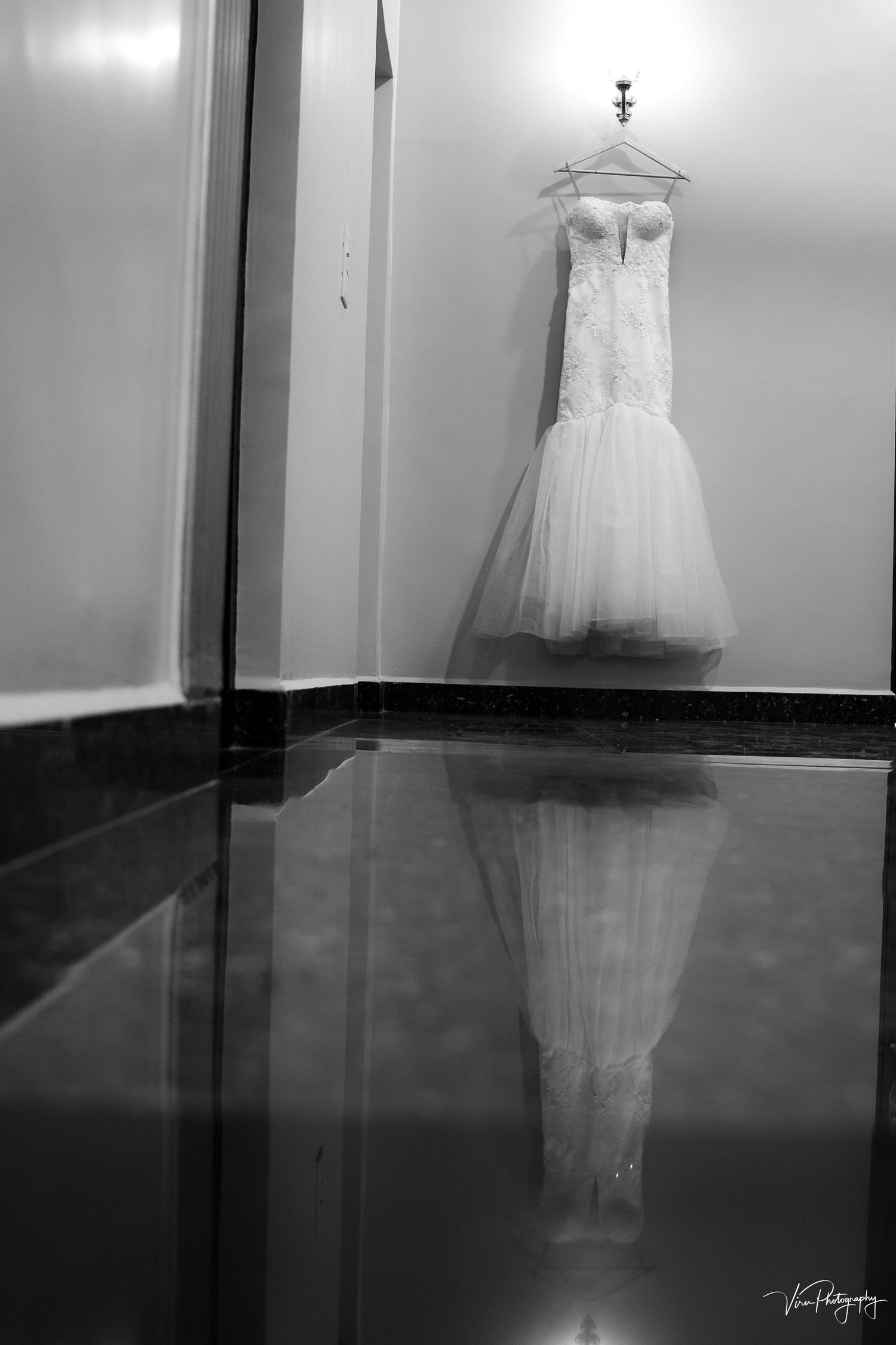 A ghostly white dress appears to float and dance through a dark room in multiple black and white photographs.