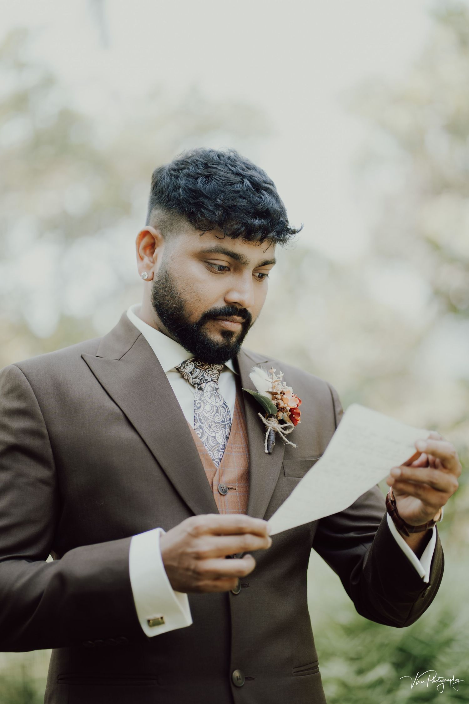 A series of photos showing groom in brown suit reading vows outdoors with floral boutonniere and patterned dress shirt.