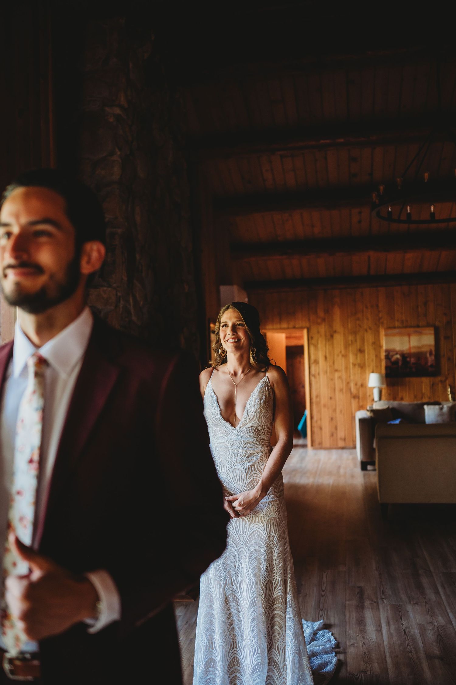 Wedding preparation moments captured in a rustic wooden interior setting.