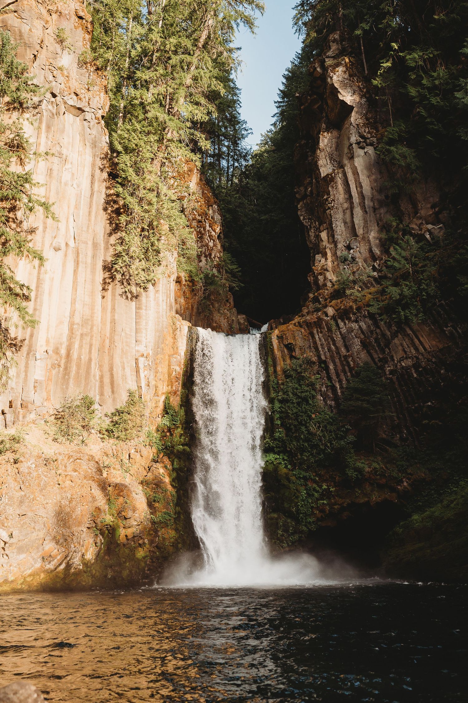 A series of scenic images showing a majestic waterfall cascading down orange rock cliffs into a tranquil pool below.